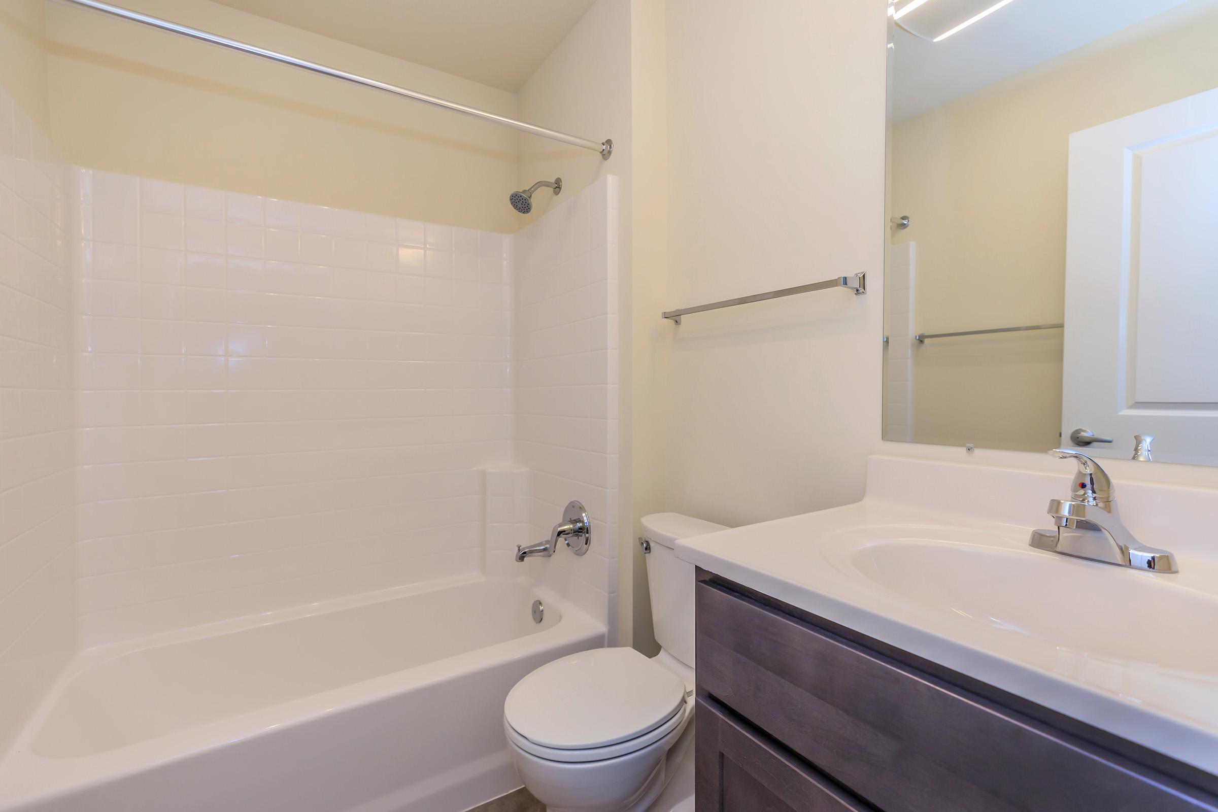a room with a sink and a bath tub