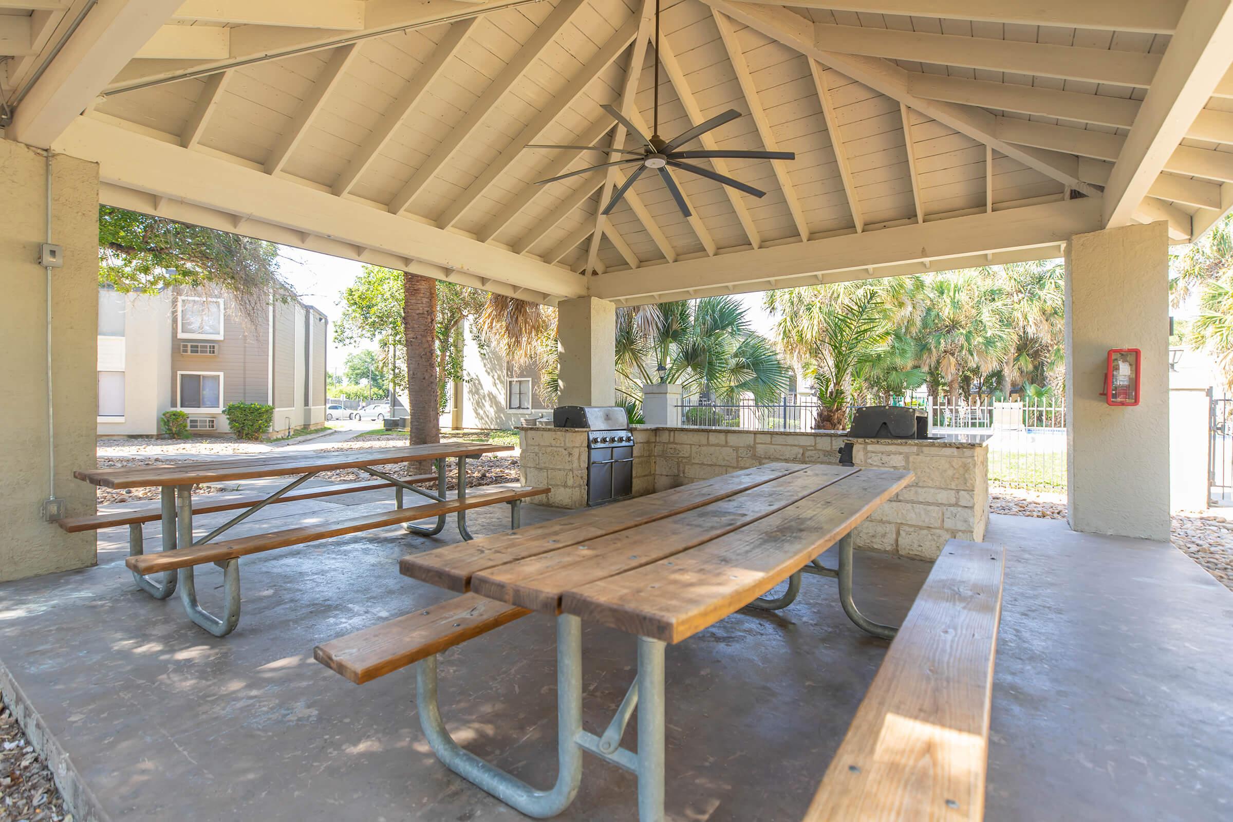 a wooden bench in front of a building