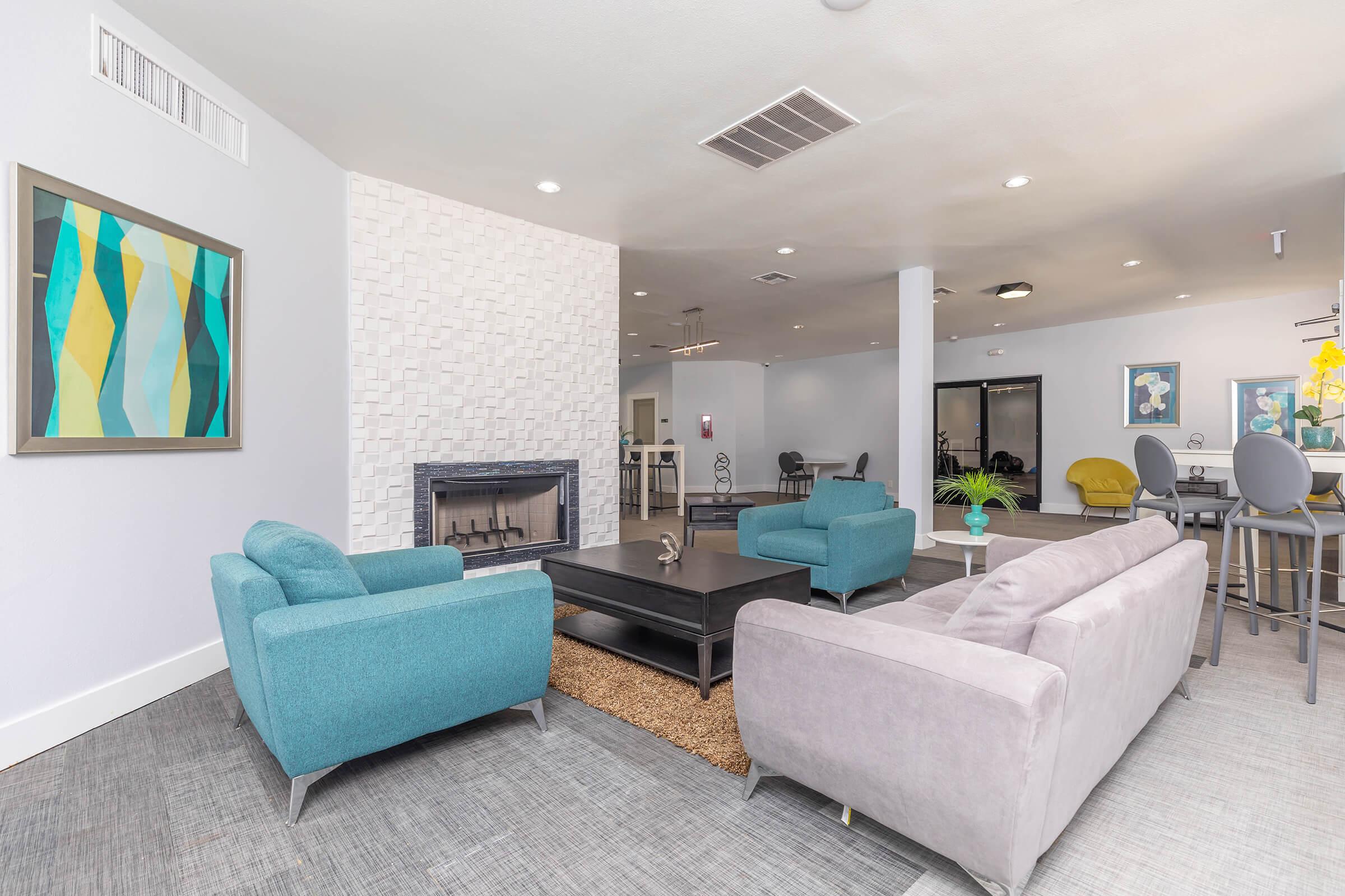 a living room filled with furniture and a flat screen tv