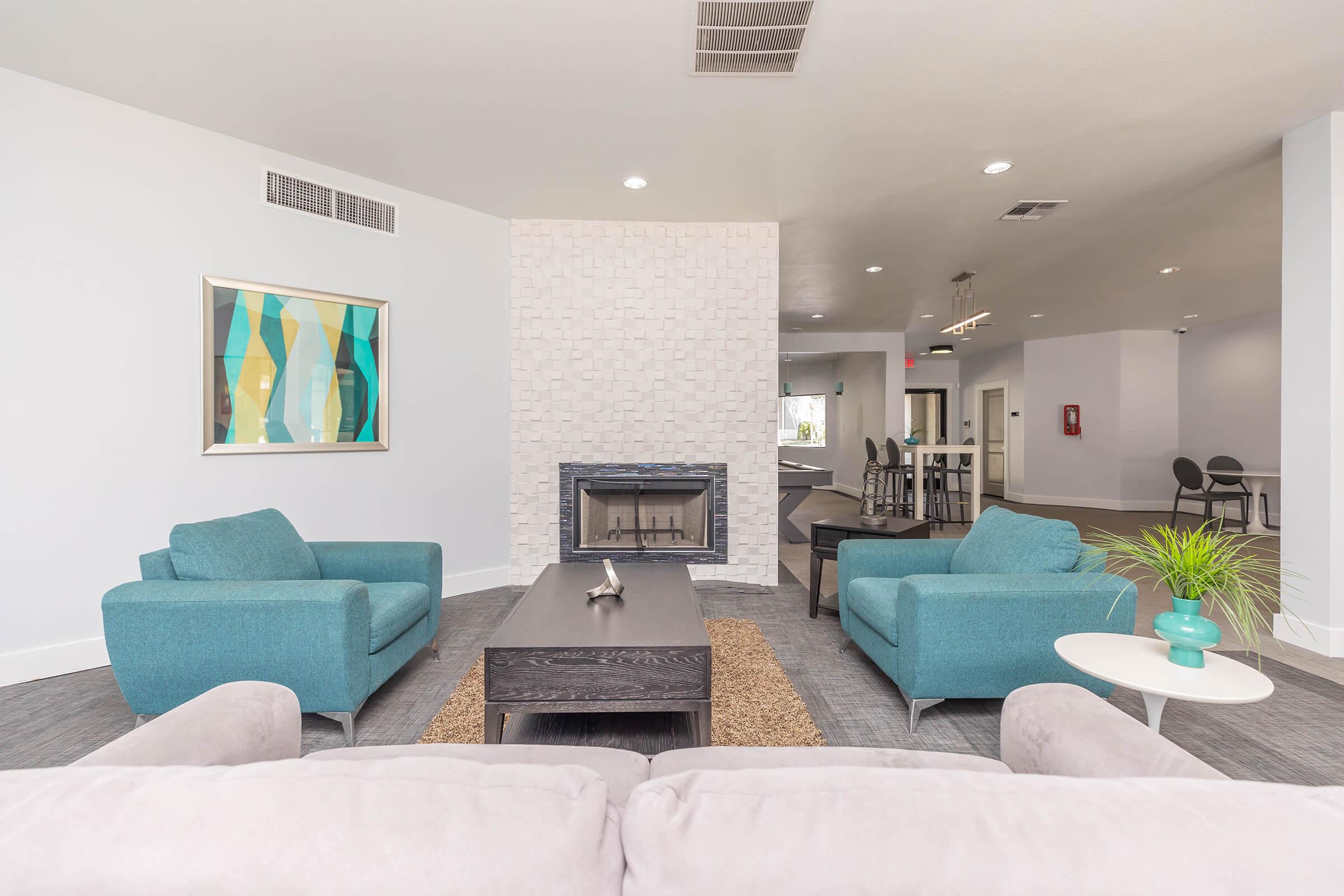 a living room filled with furniture and a bed