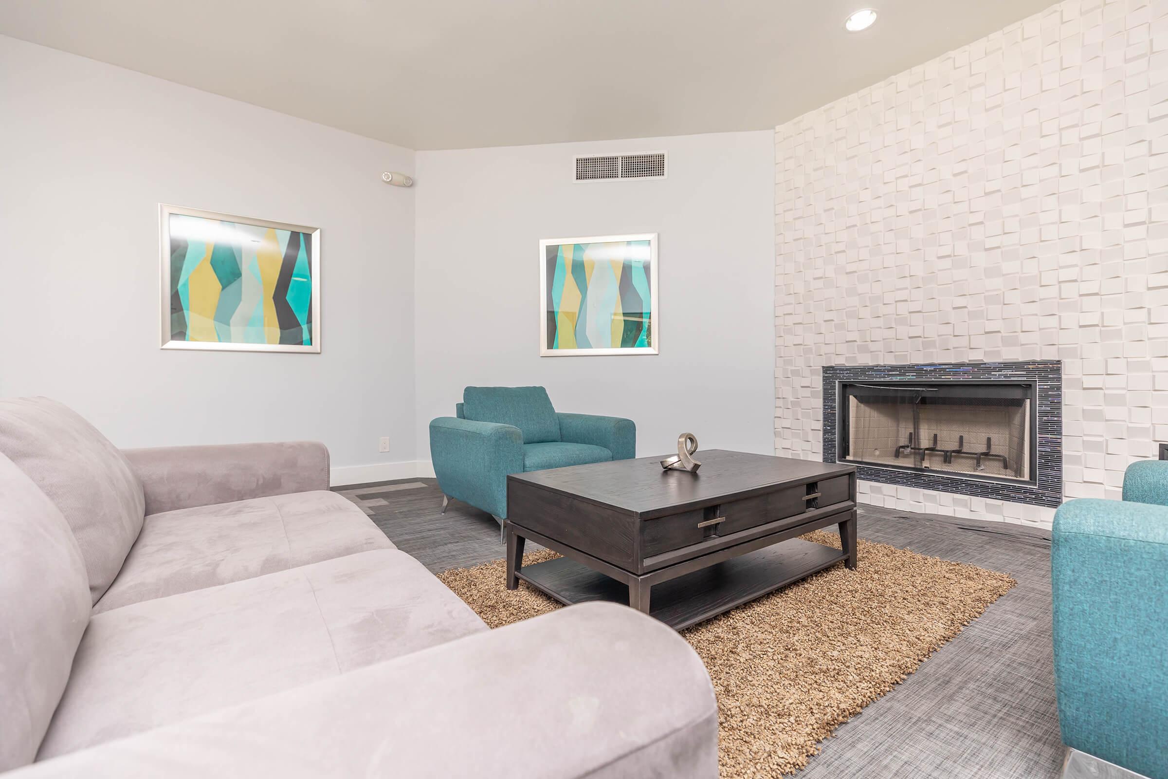 a living room filled with furniture and a flat screen tv