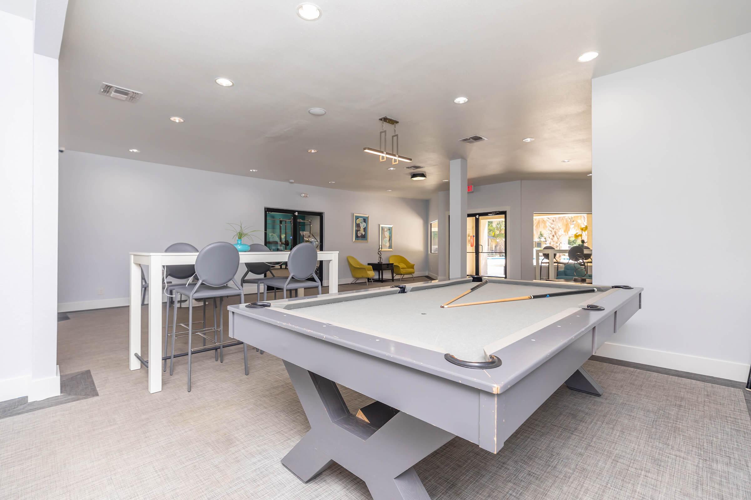 an office with a desk and chair in a room