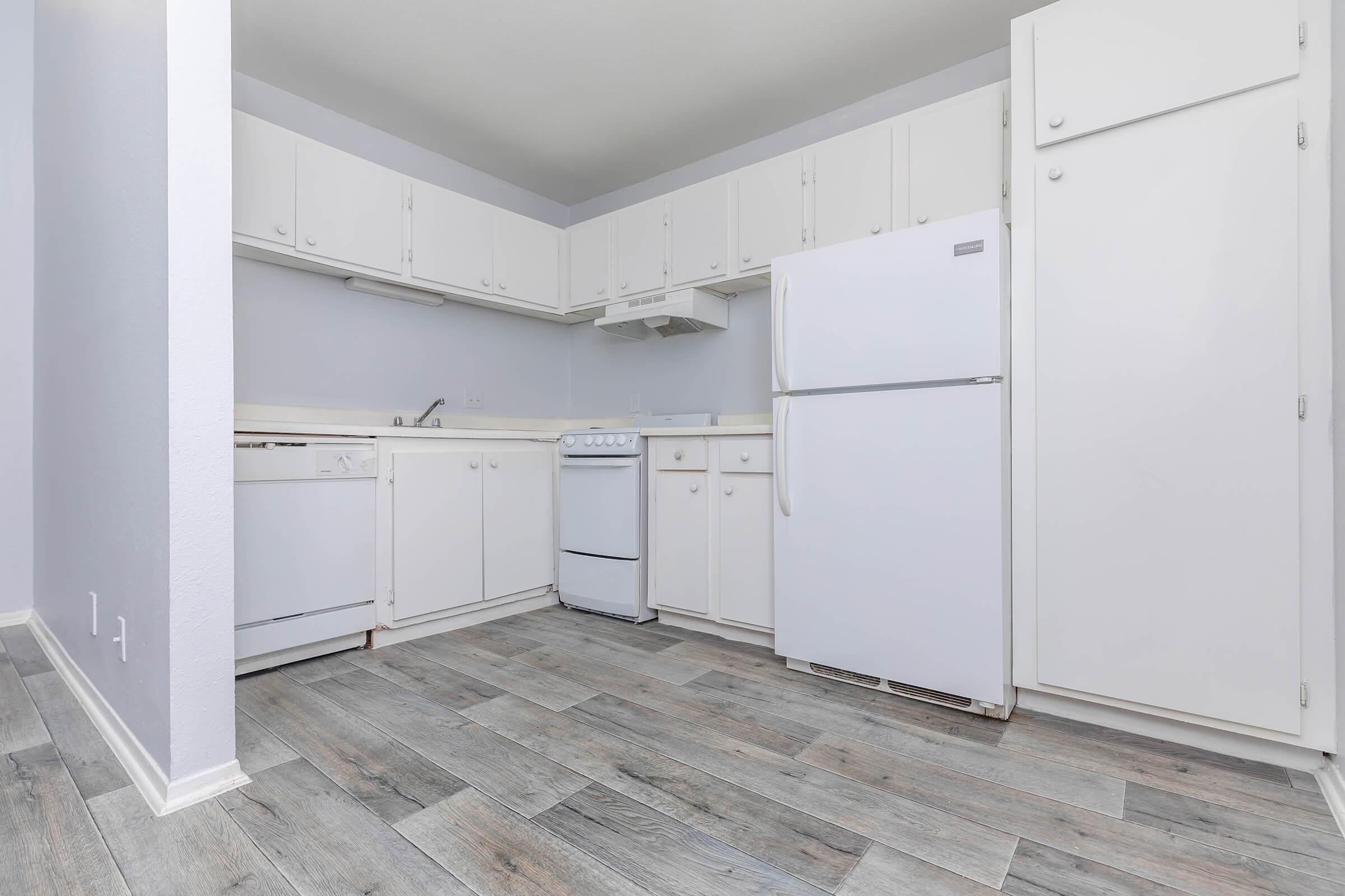 a kitchen with a building in the background