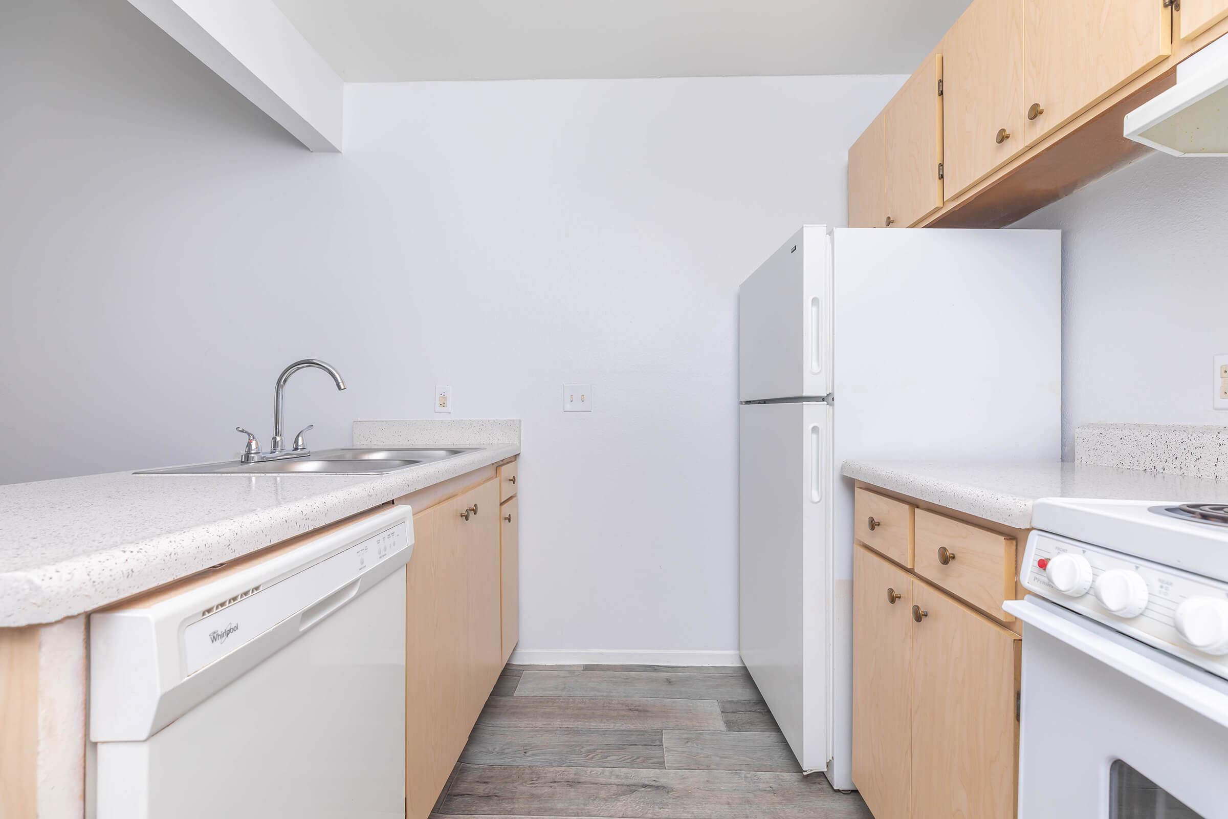 a kitchen with a stove top oven sitting inside of a refrigerator