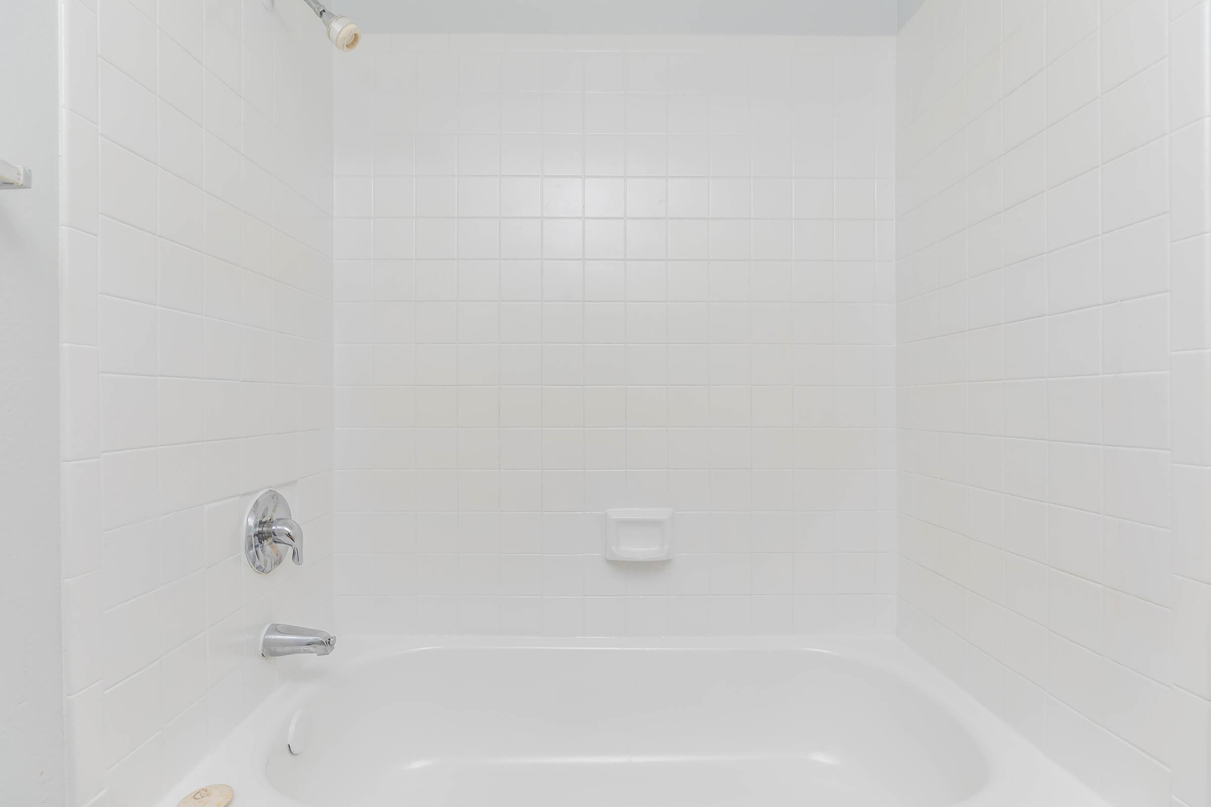 a room with a sink and a bath tub