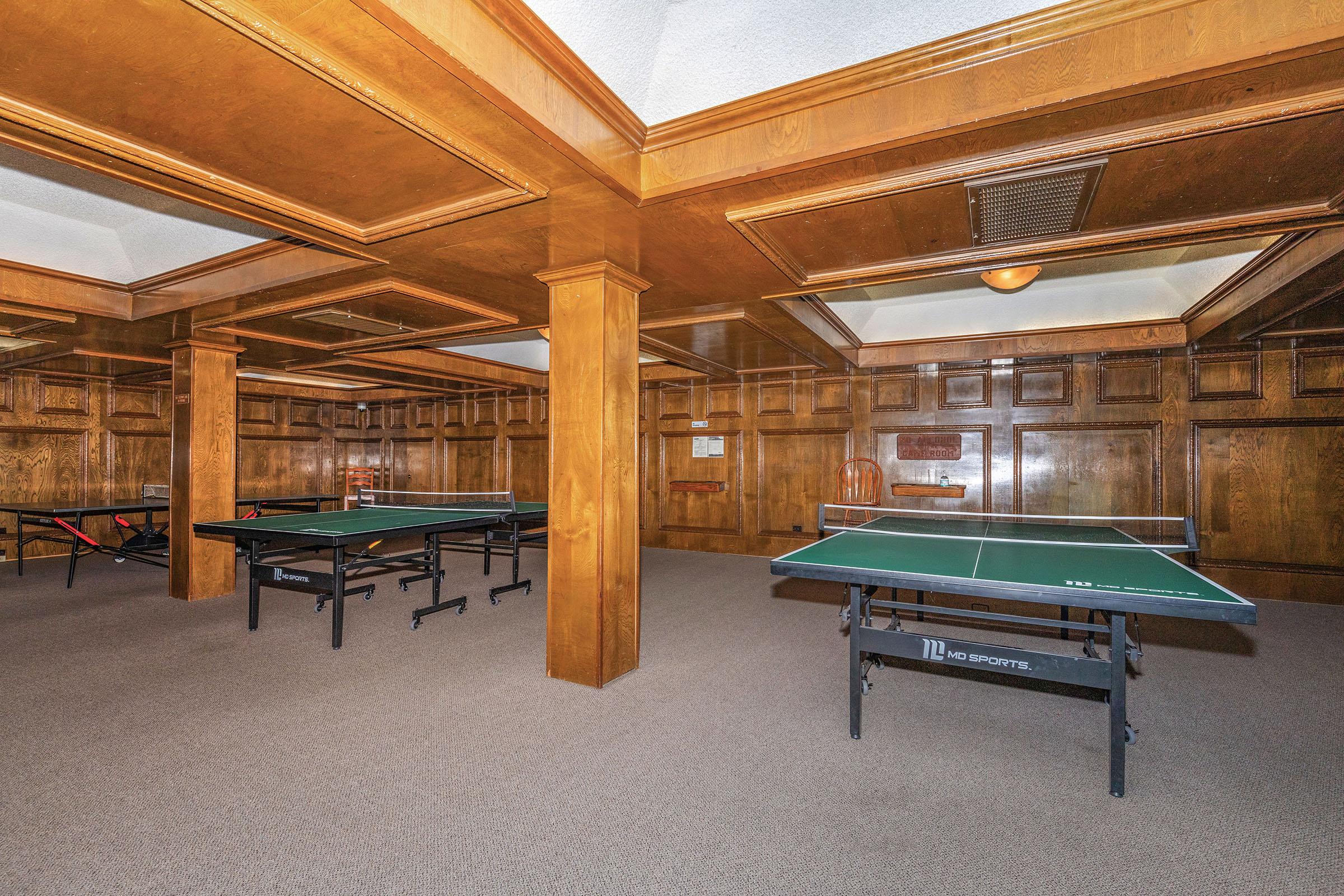 a room filled with furniture and a table in front of a building