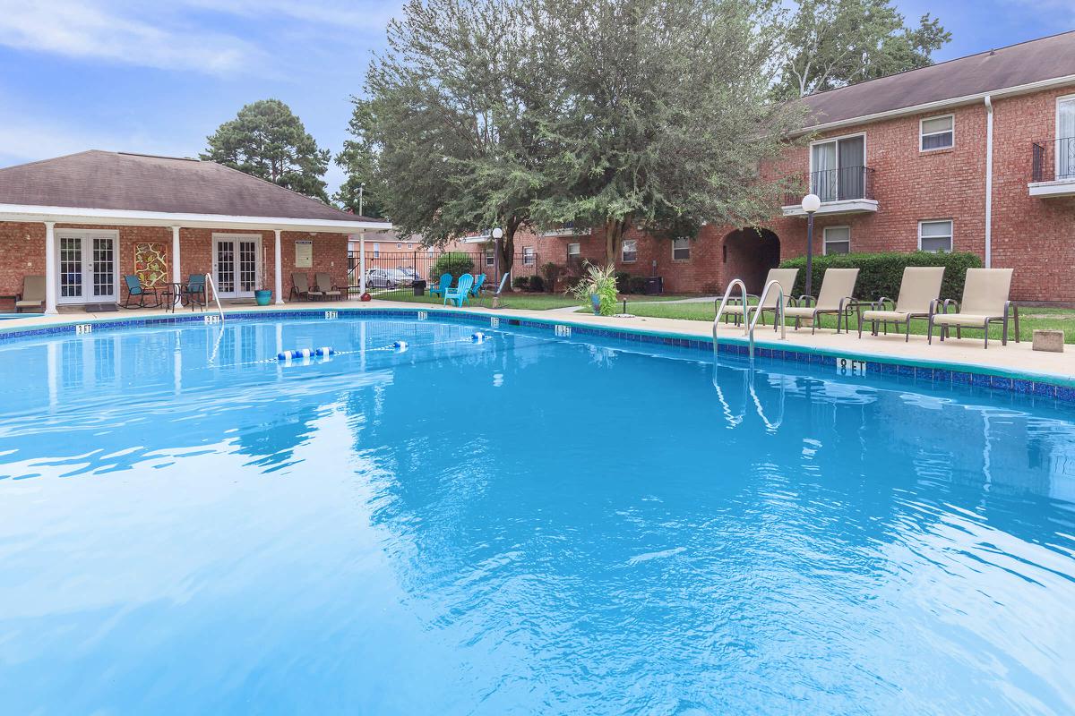a large pool of water in front of a house