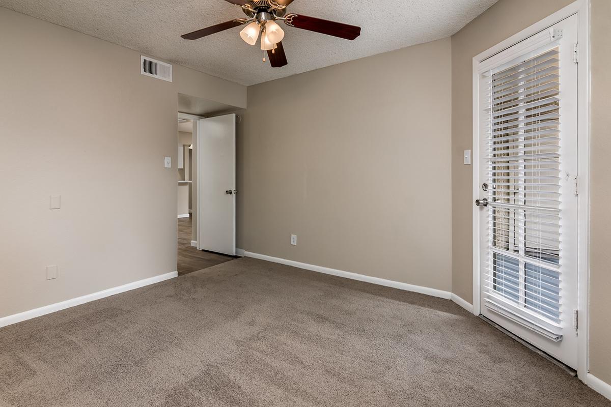2 bedroom apartment bedroom with door out to a large balcony and extra large closet space