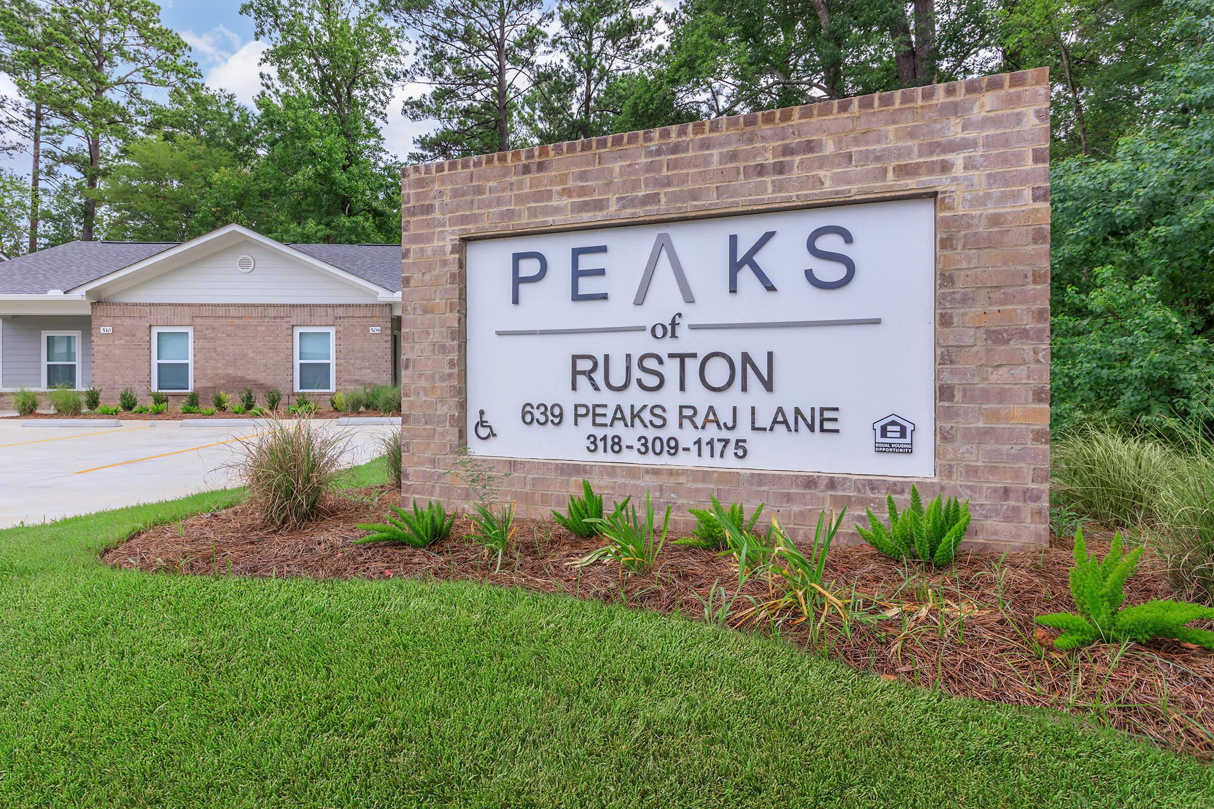 a house that has a sign on the side of a building