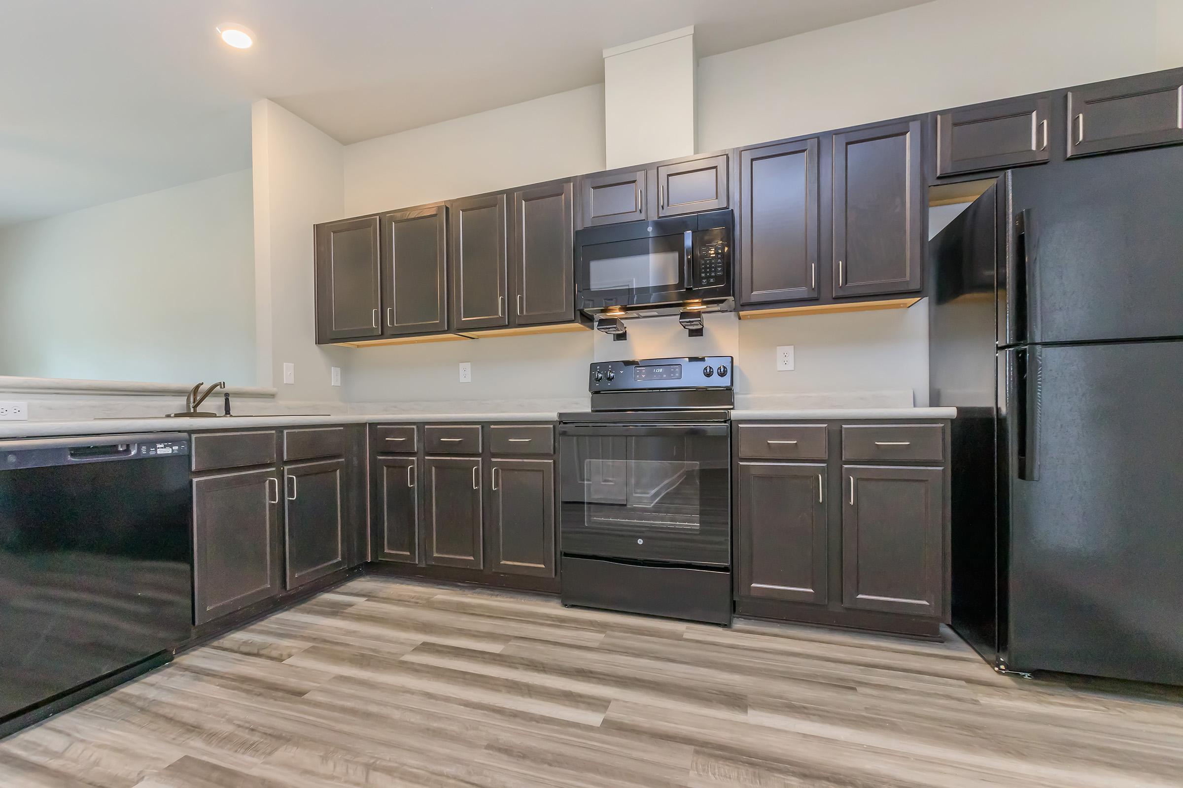 a large kitchen with stainless steel appliances