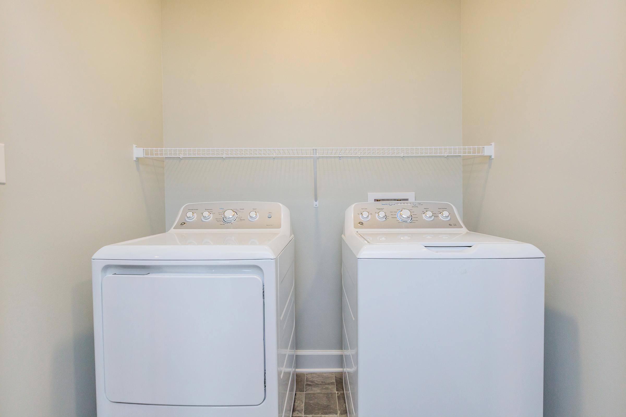 a refrigerator freezer sitting next to a sink