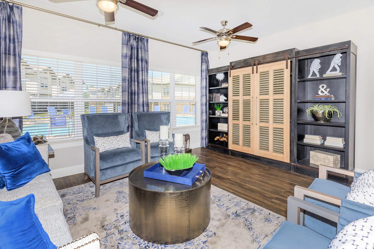 a living room filled with furniture and a fireplace