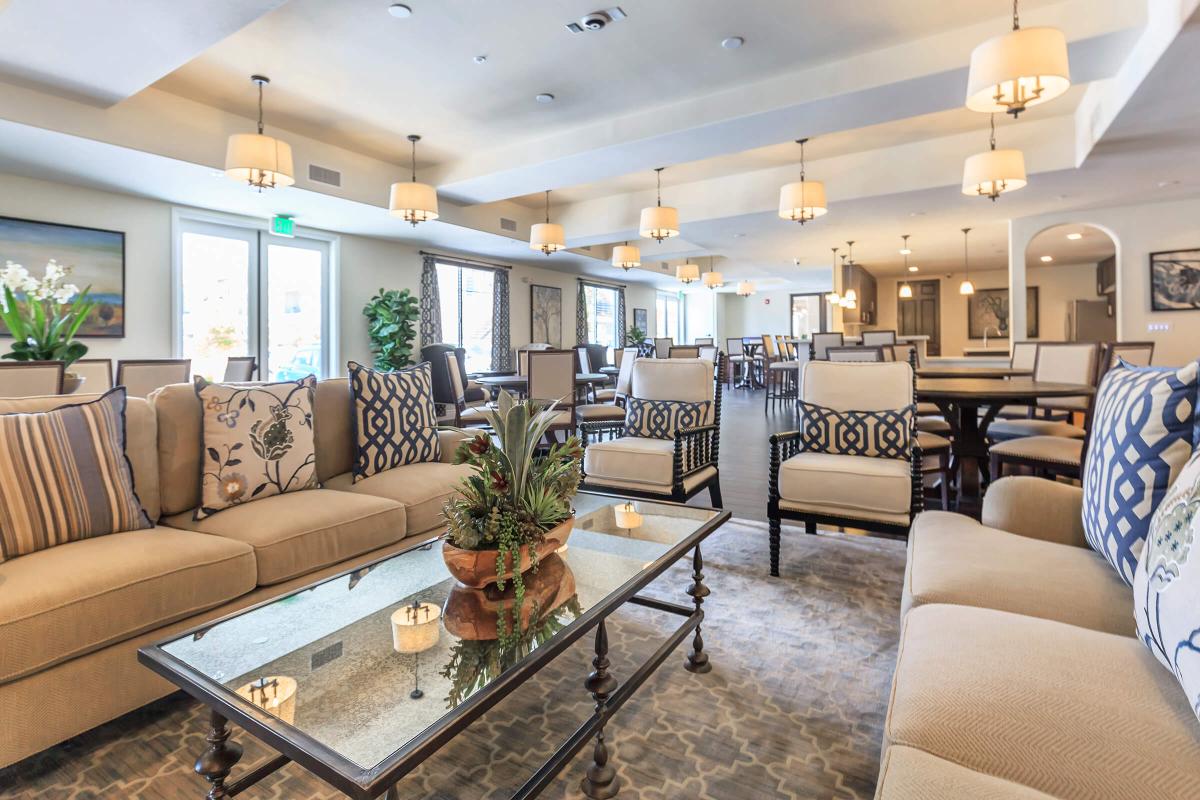 a living room filled with furniture and vase