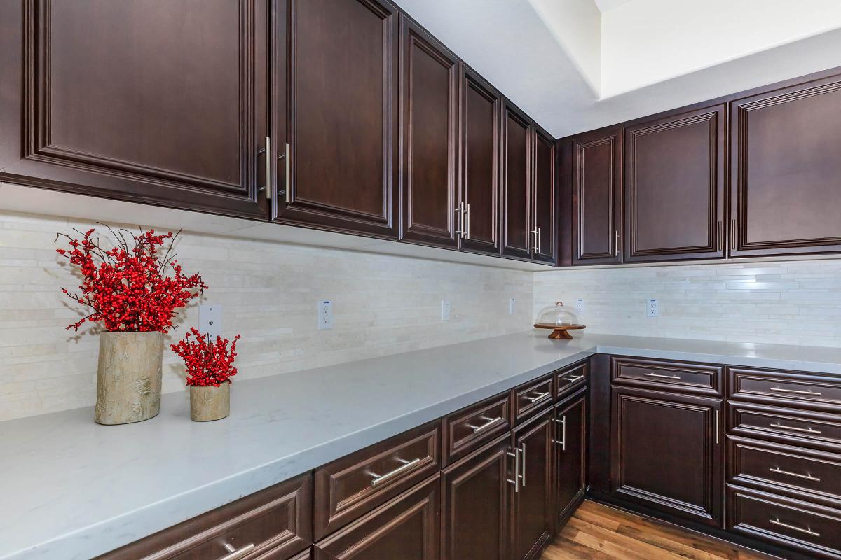 a kitchen with stainless steel appliances and wooden cabinets