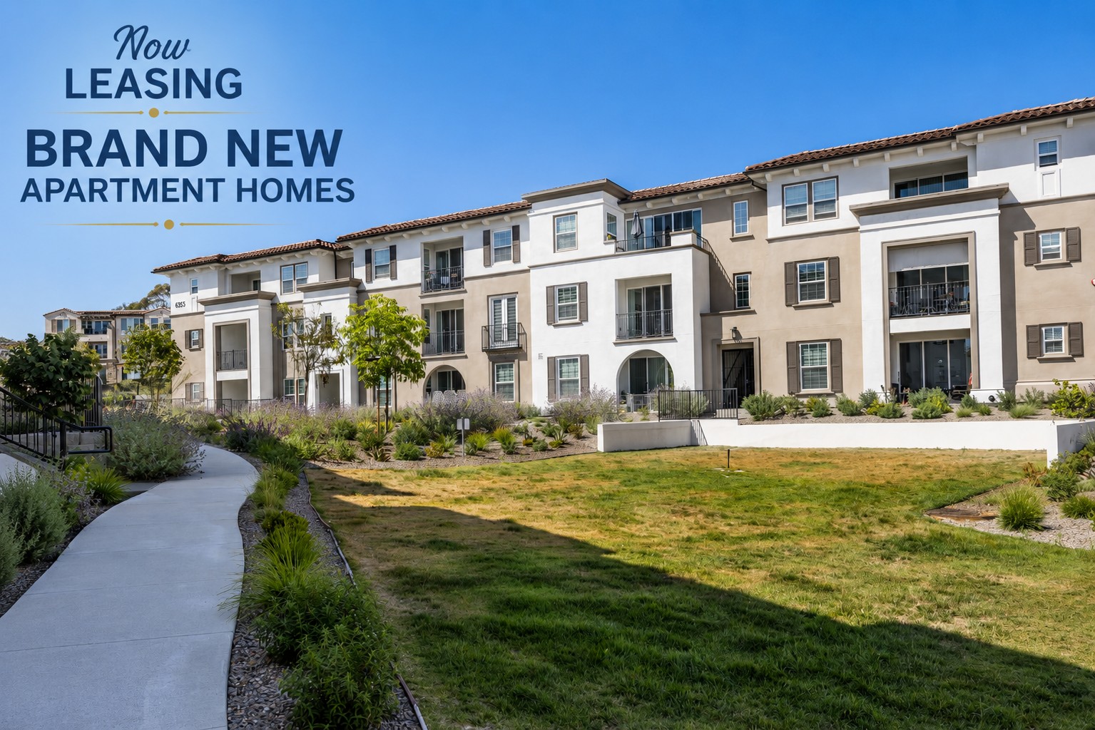 A modern apartment complex featuring multiple buildings with balconies and large windows, surrounded by landscaped greenery. A pathway leads through the area, and a sign highlights that brand new apartment homes are now available for leasing.