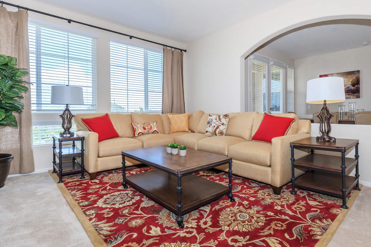 a living room filled with furniture and a fire place