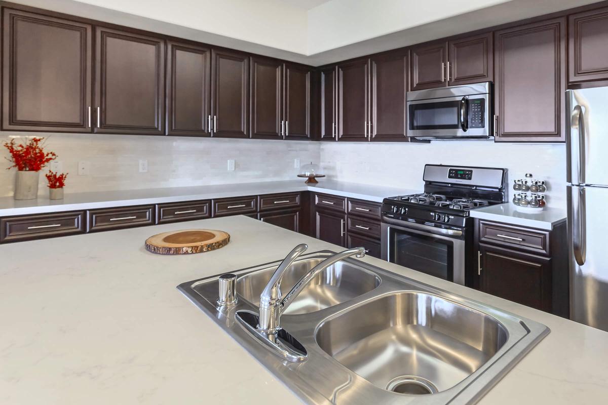 a modern kitchen with stainless steel appliances