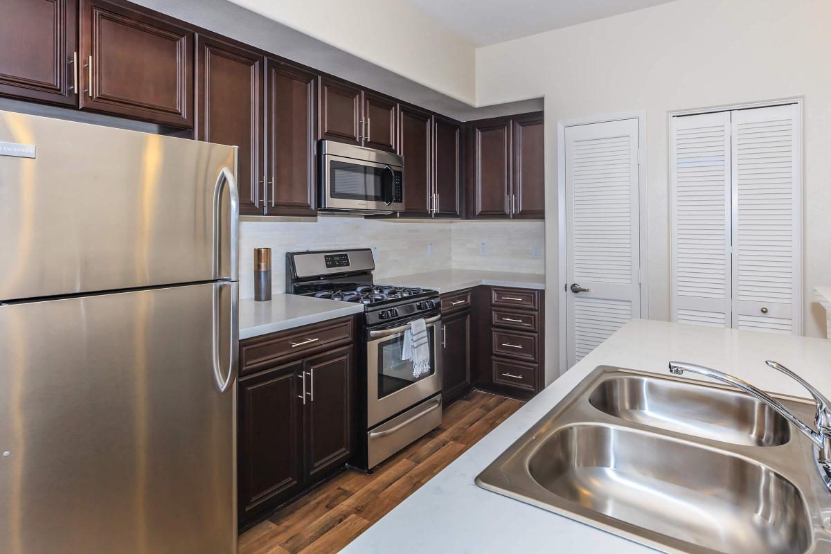 a modern kitchen with stainless steel appliances