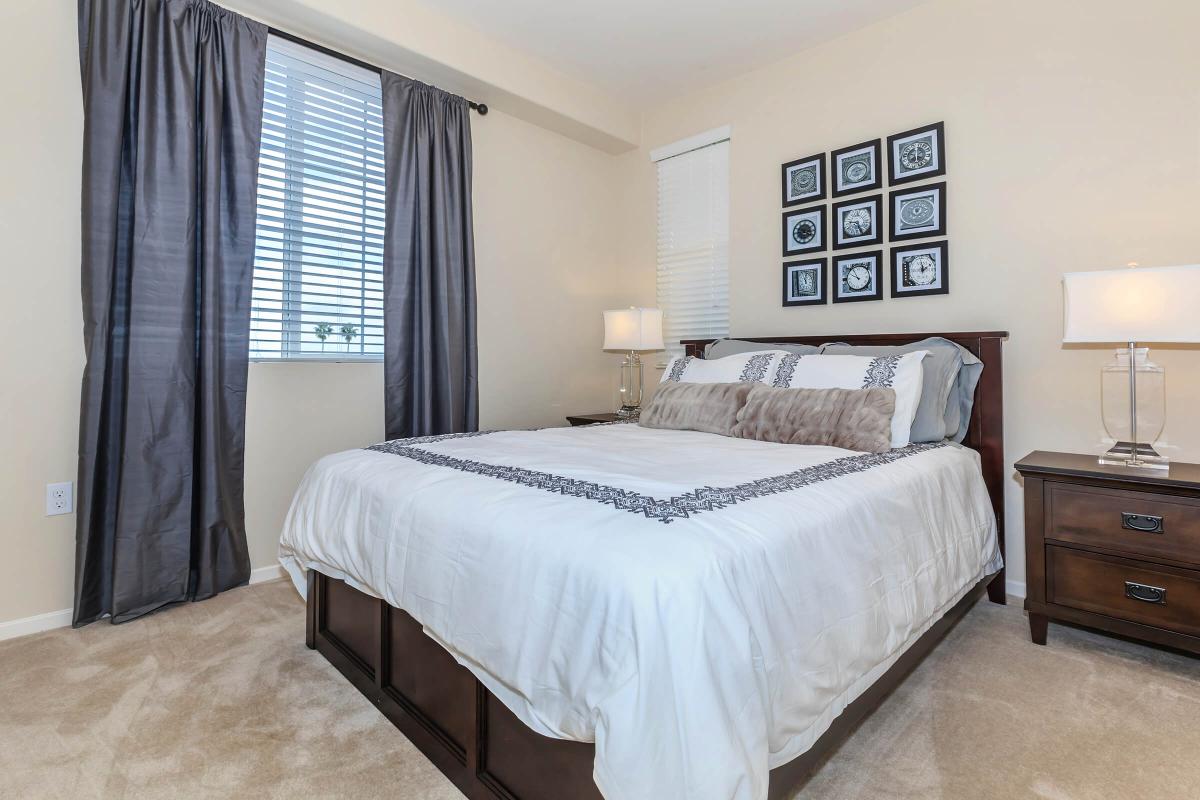 a bedroom with a large bed in a hotel room