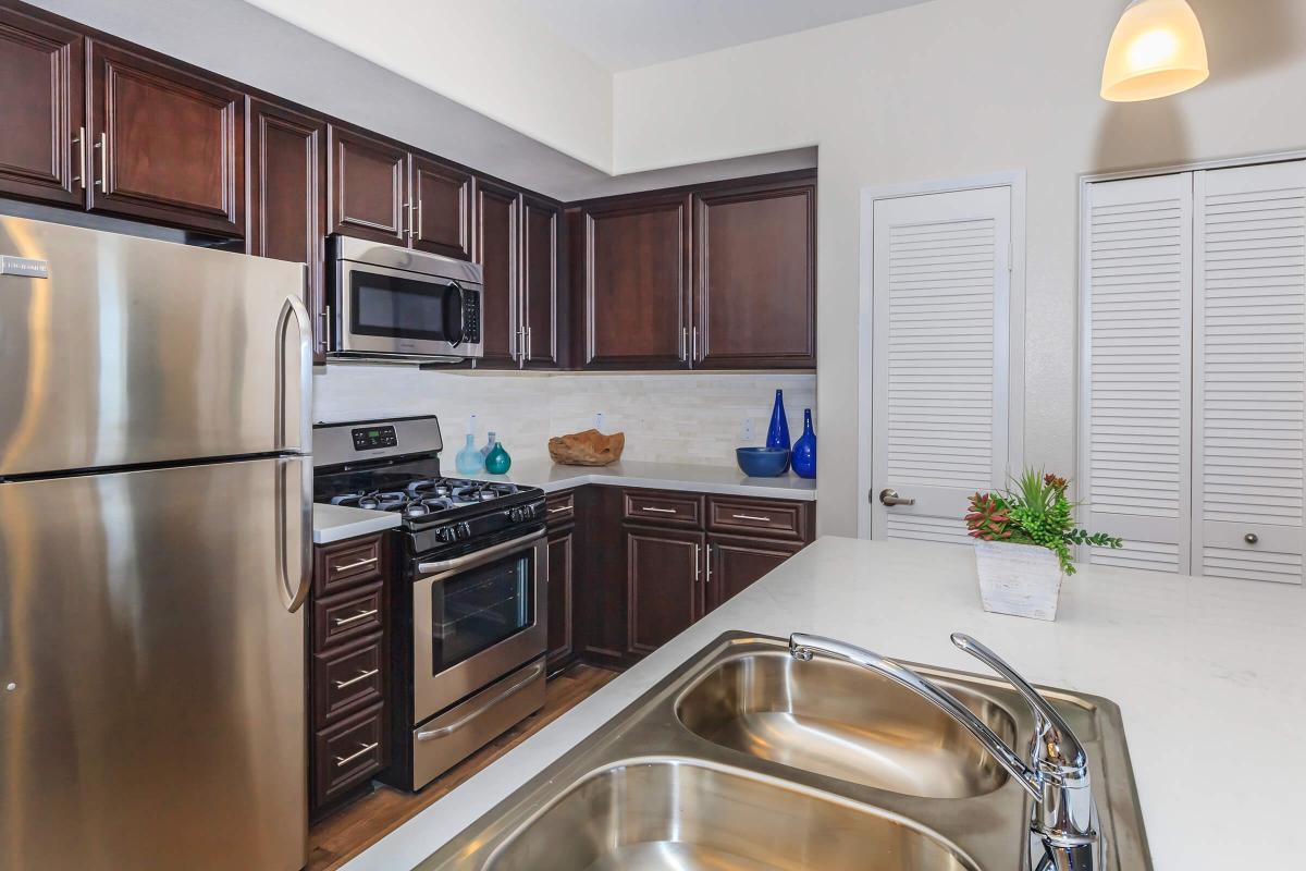 a kitchen with stainless steel appliances