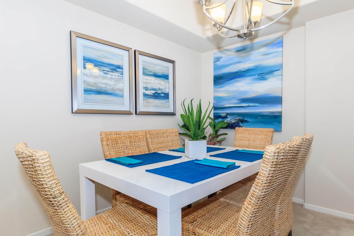 a table topped with a blue chair