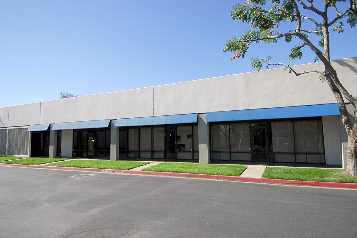 an empty parking lot in front of a building