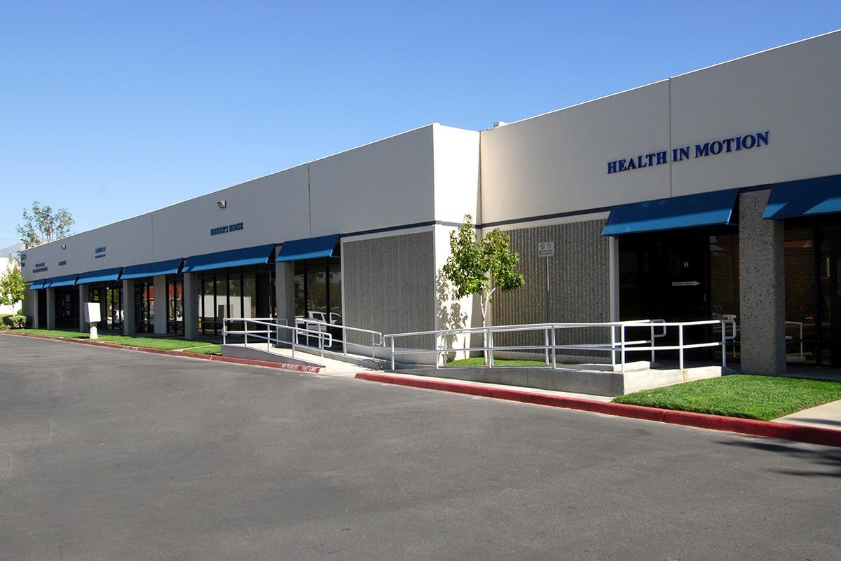 a large empty parking lot in front of a building