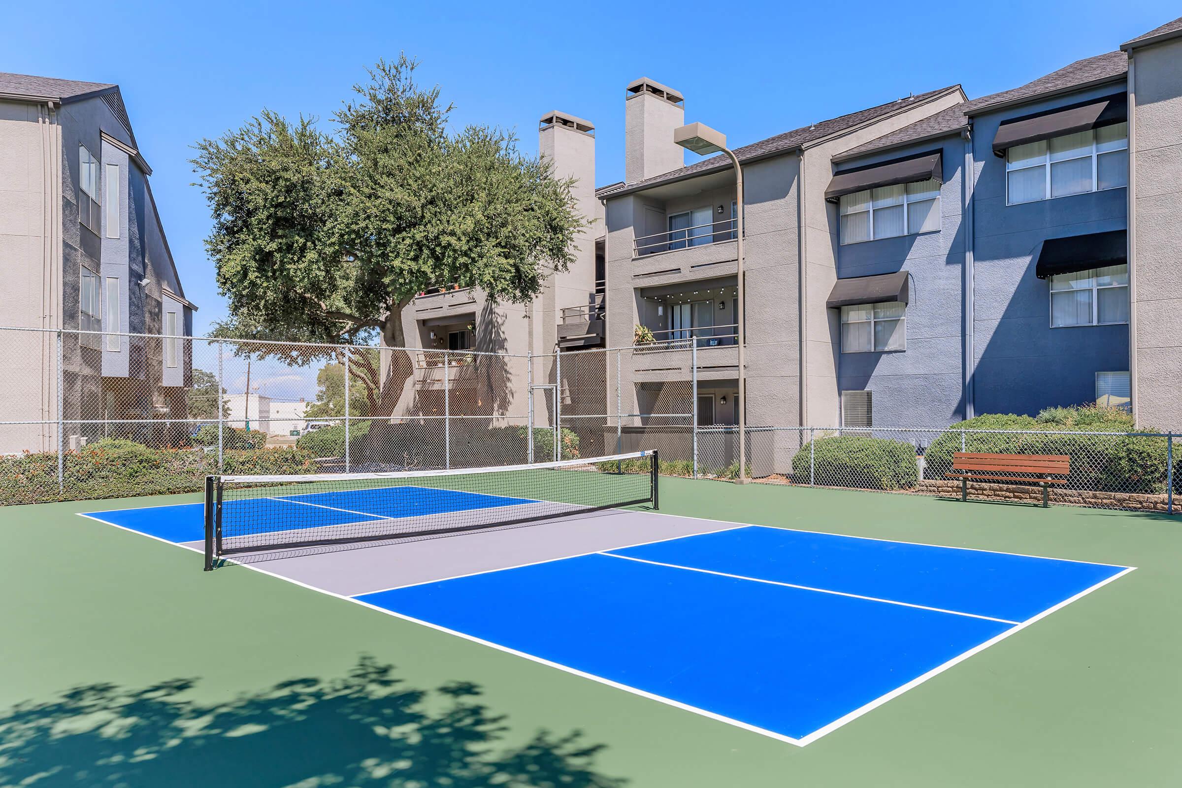 a house with a pool in front of a building