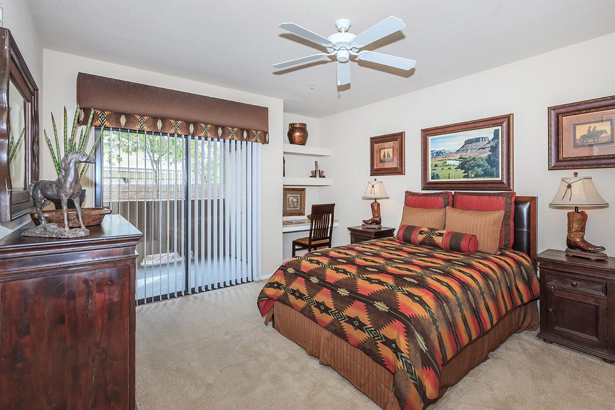 Comfortable bedroom at The Palladium Apartments in Las Vegas, Nevada