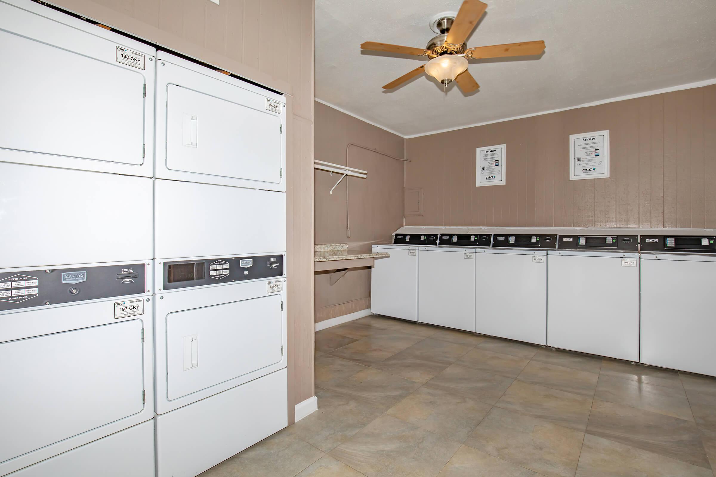 a kitchen with white cabinets