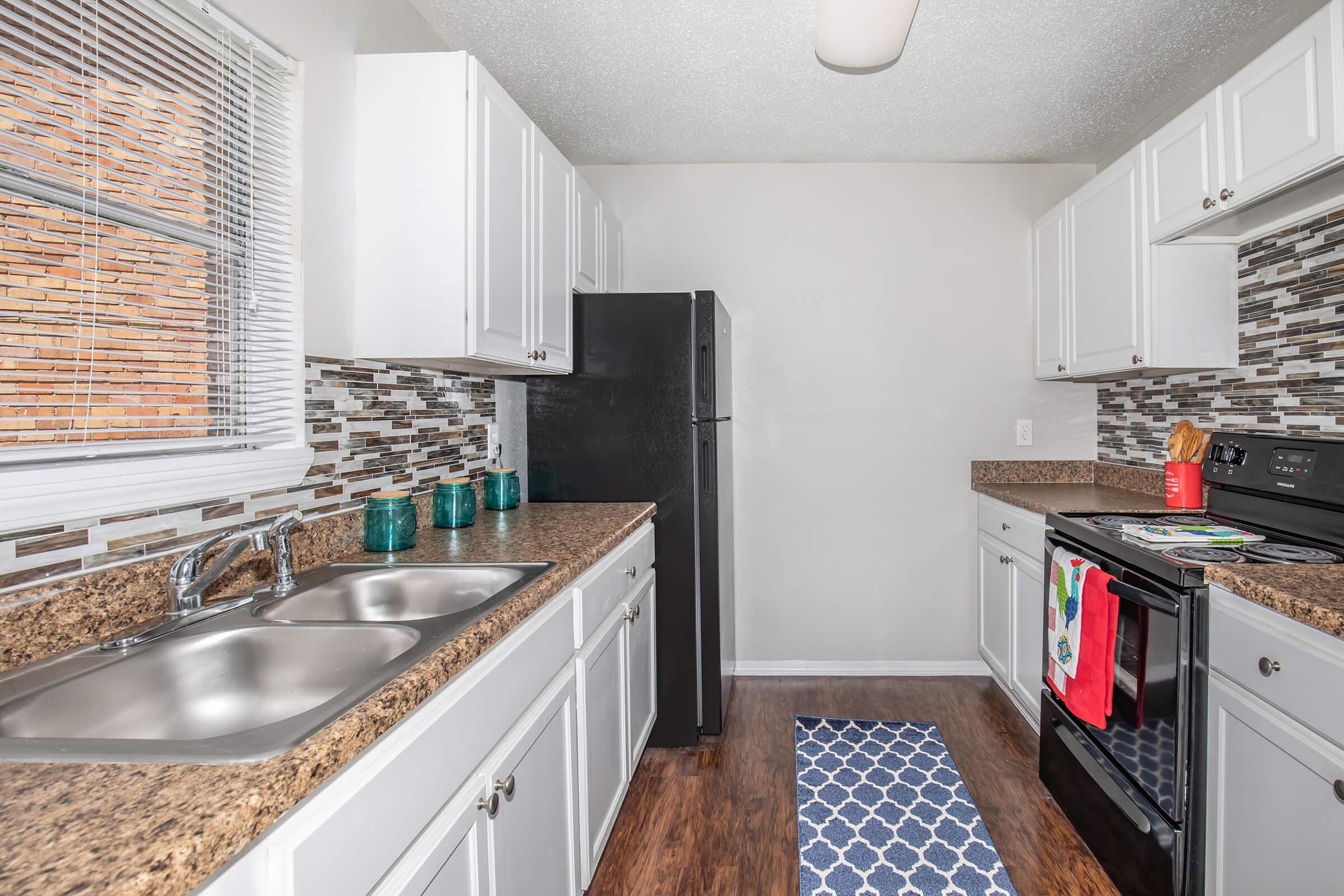 a modern kitchen with stainless steel appliances