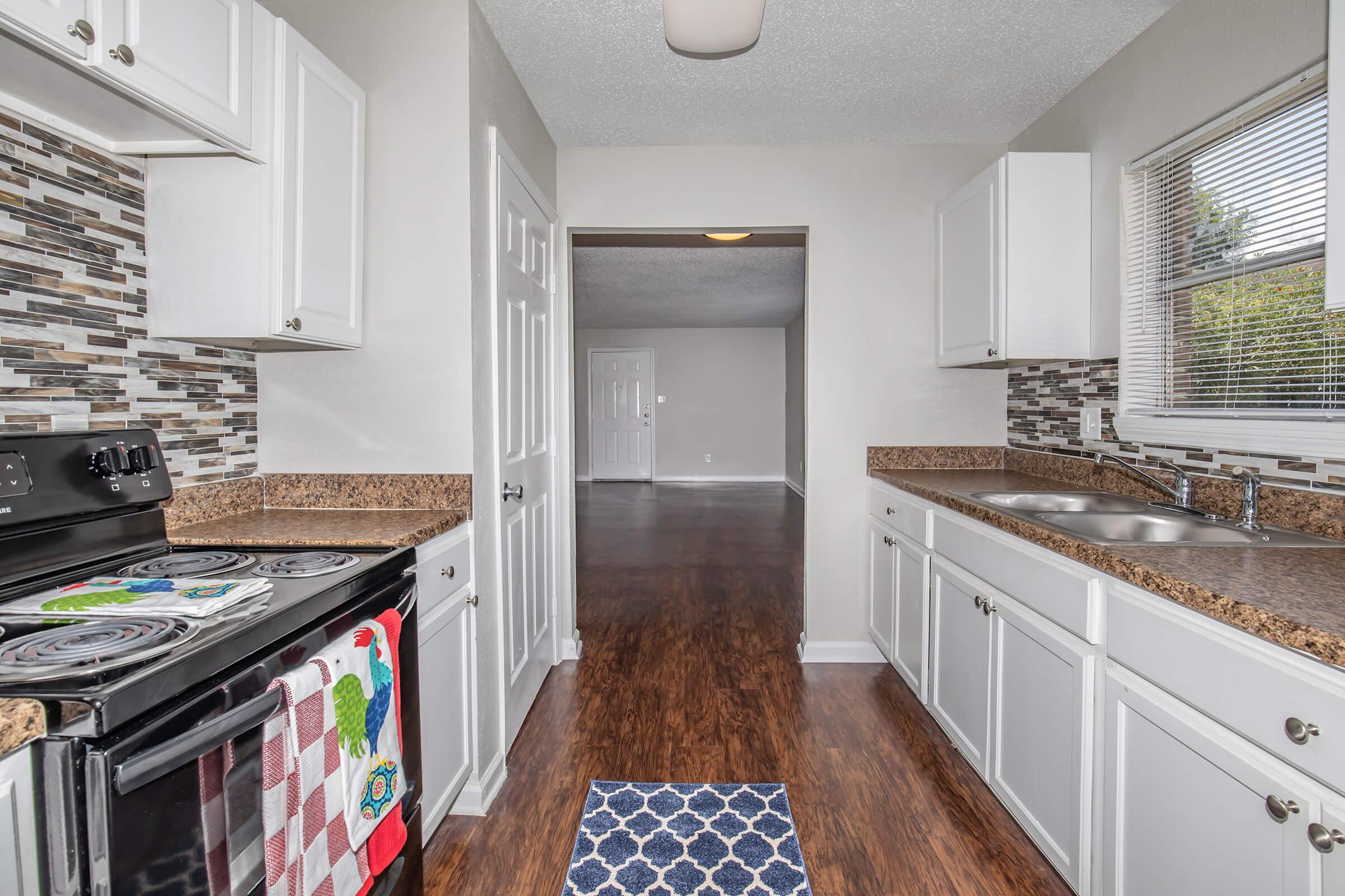 a kitchen with an island in the middle of a room