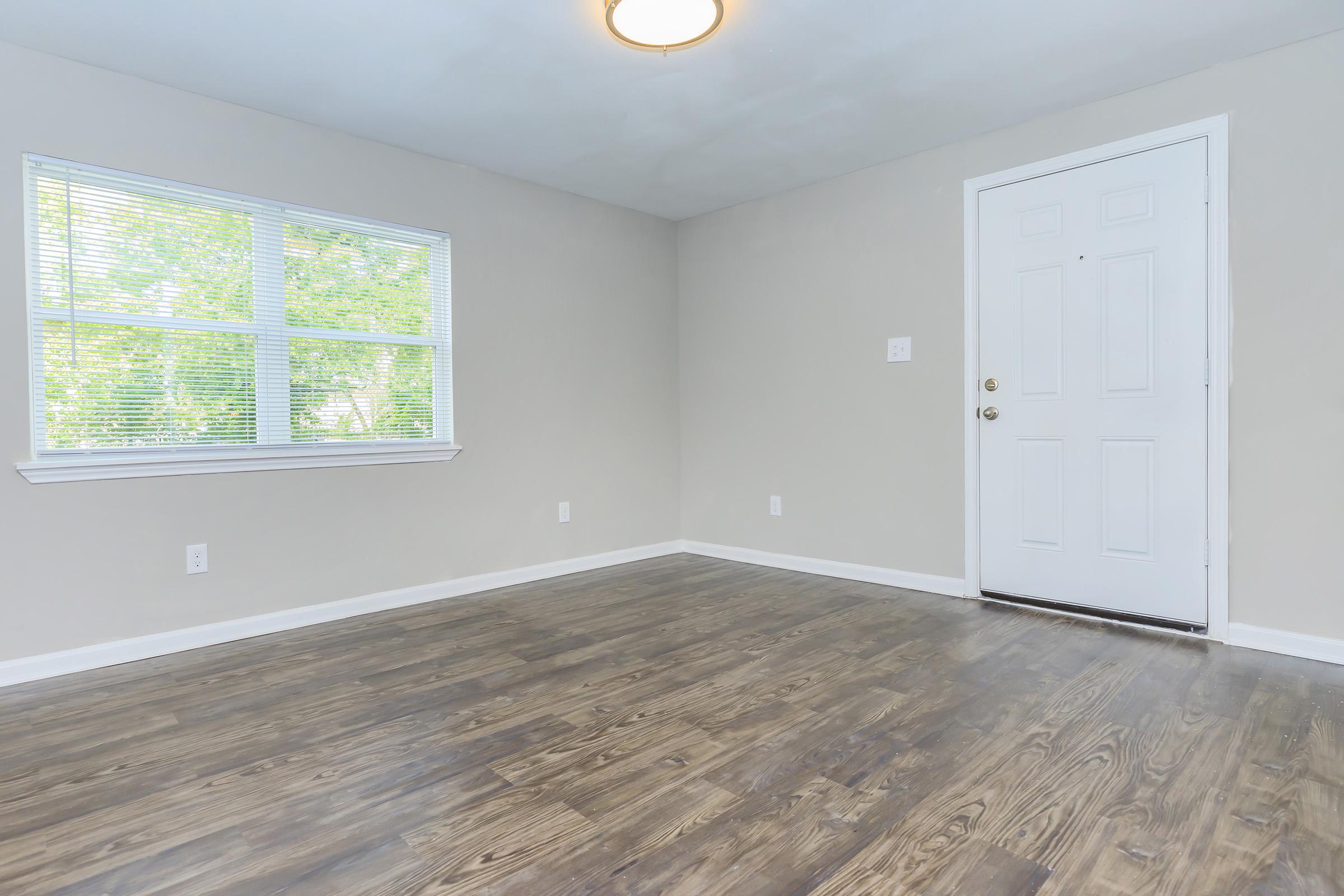 AMPLE NATURAL LIGHT WITH AVAILABLE FAUX WOOD FLOORING IN HOUSTON, TX