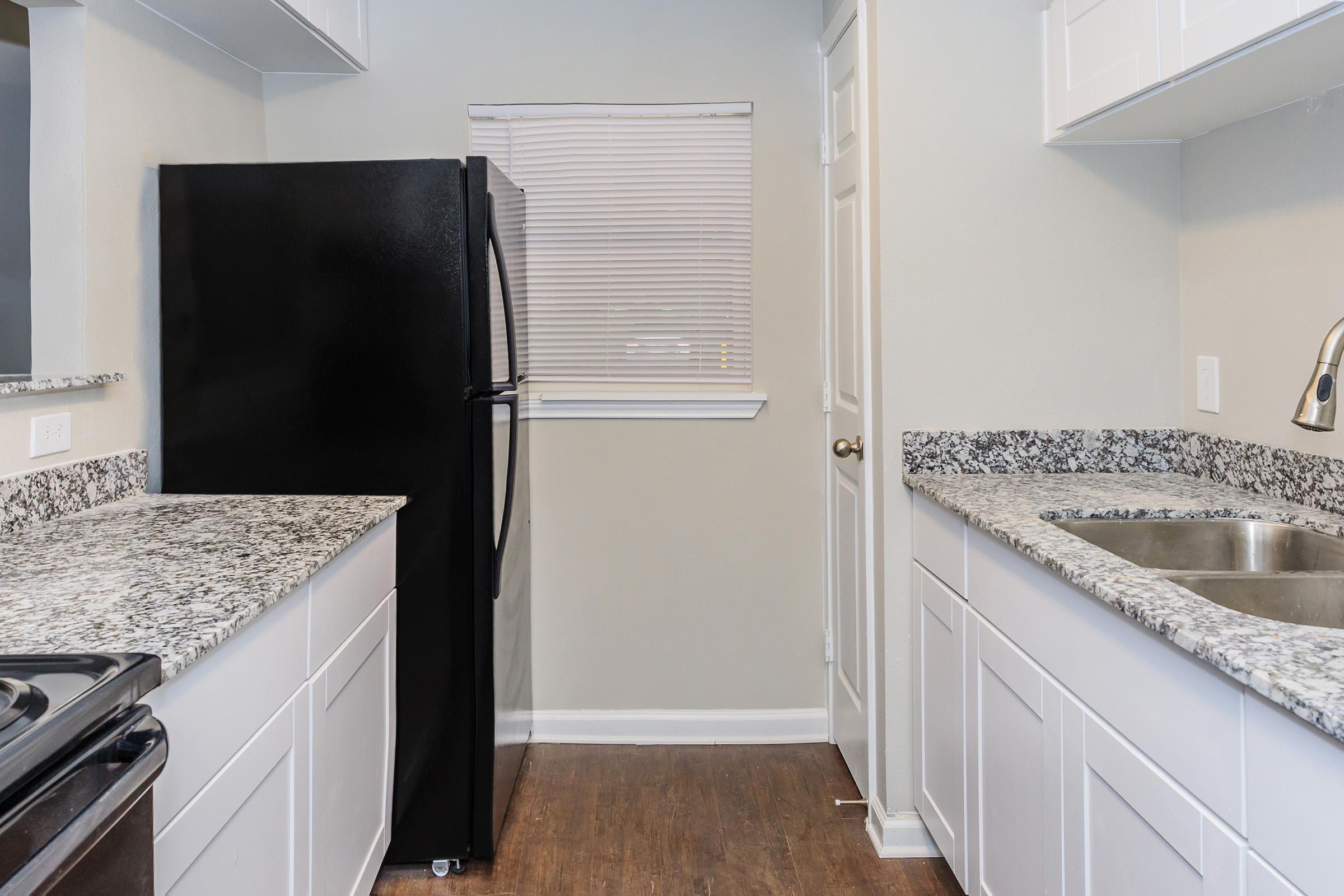 a kitchen with a sink and a window