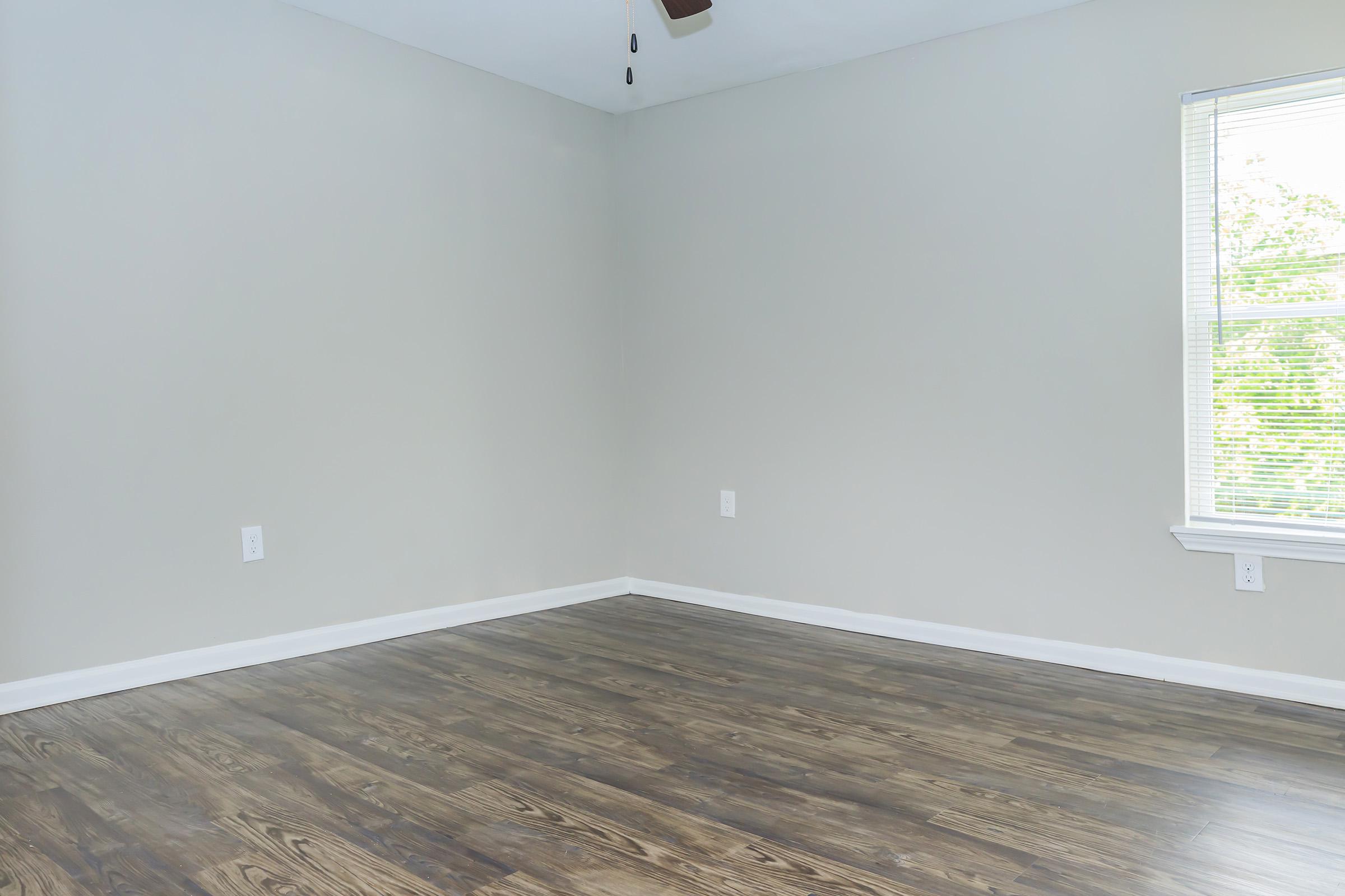 a bedroom with a large window