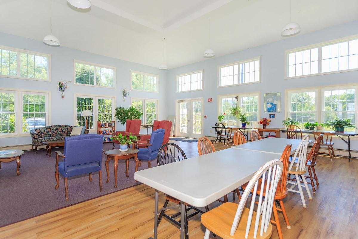 a dining room table in front of a window