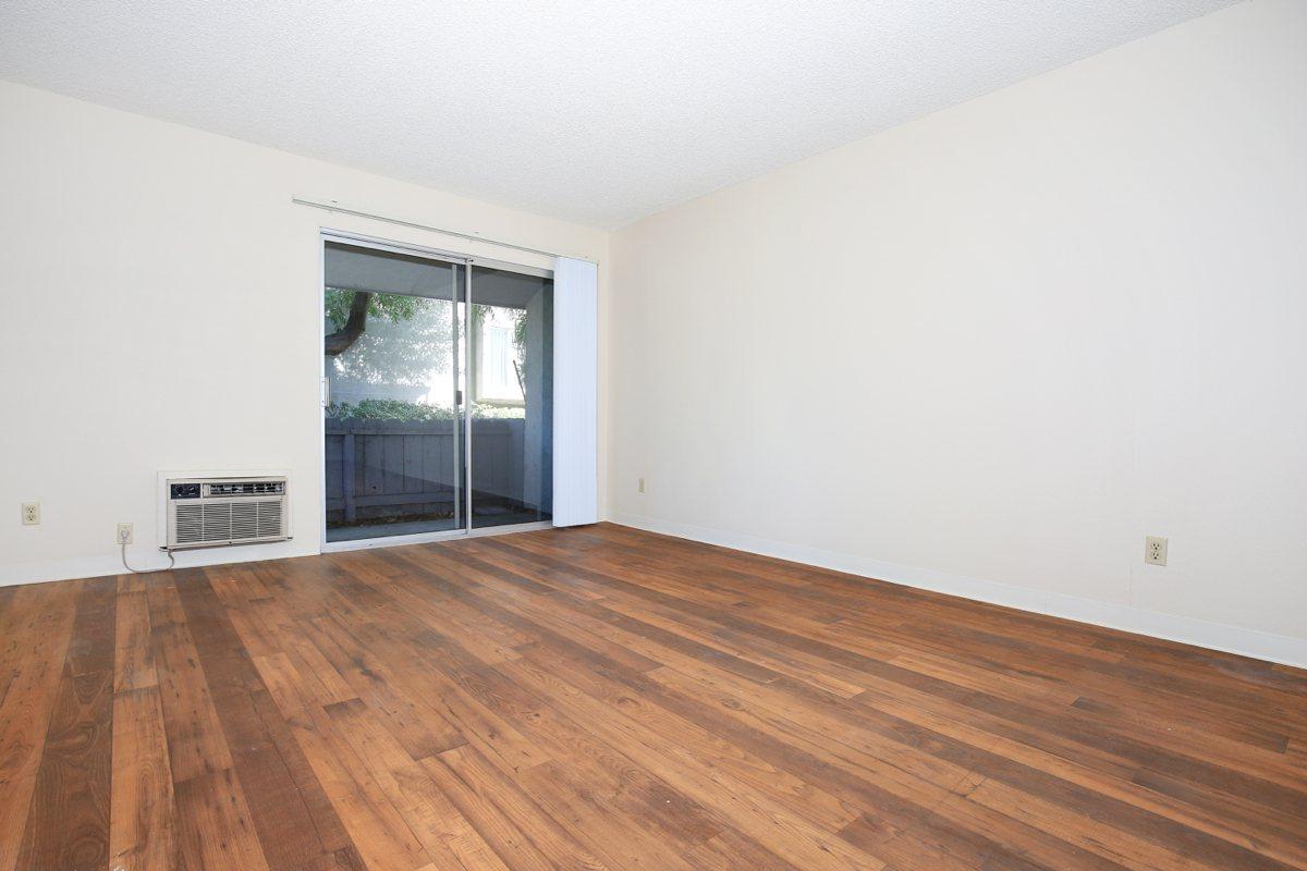 a large empty room with a wooden floor