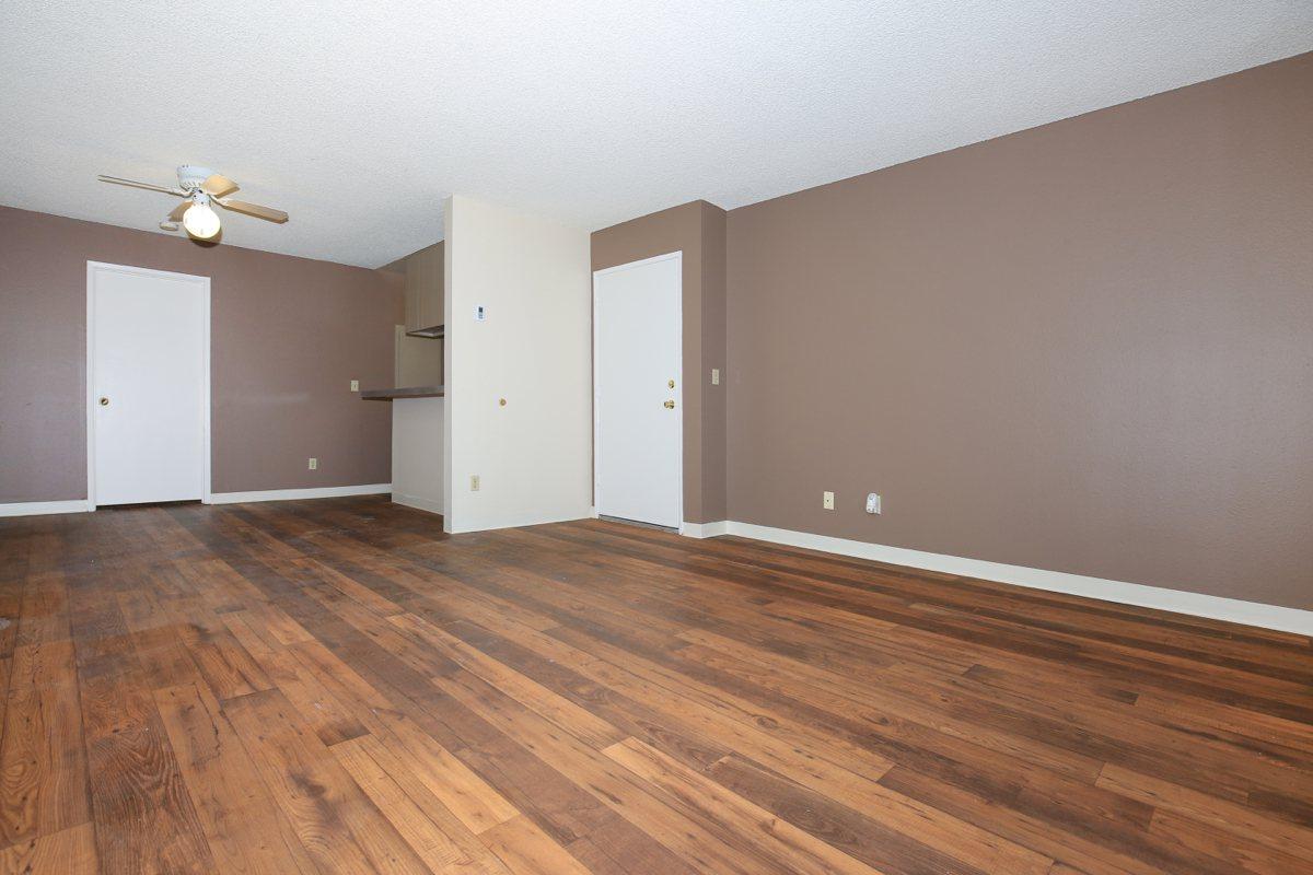 a large empty room with a wooden floor