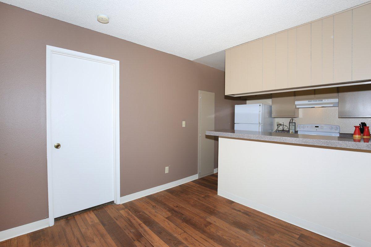 a kitchen with a wood floor