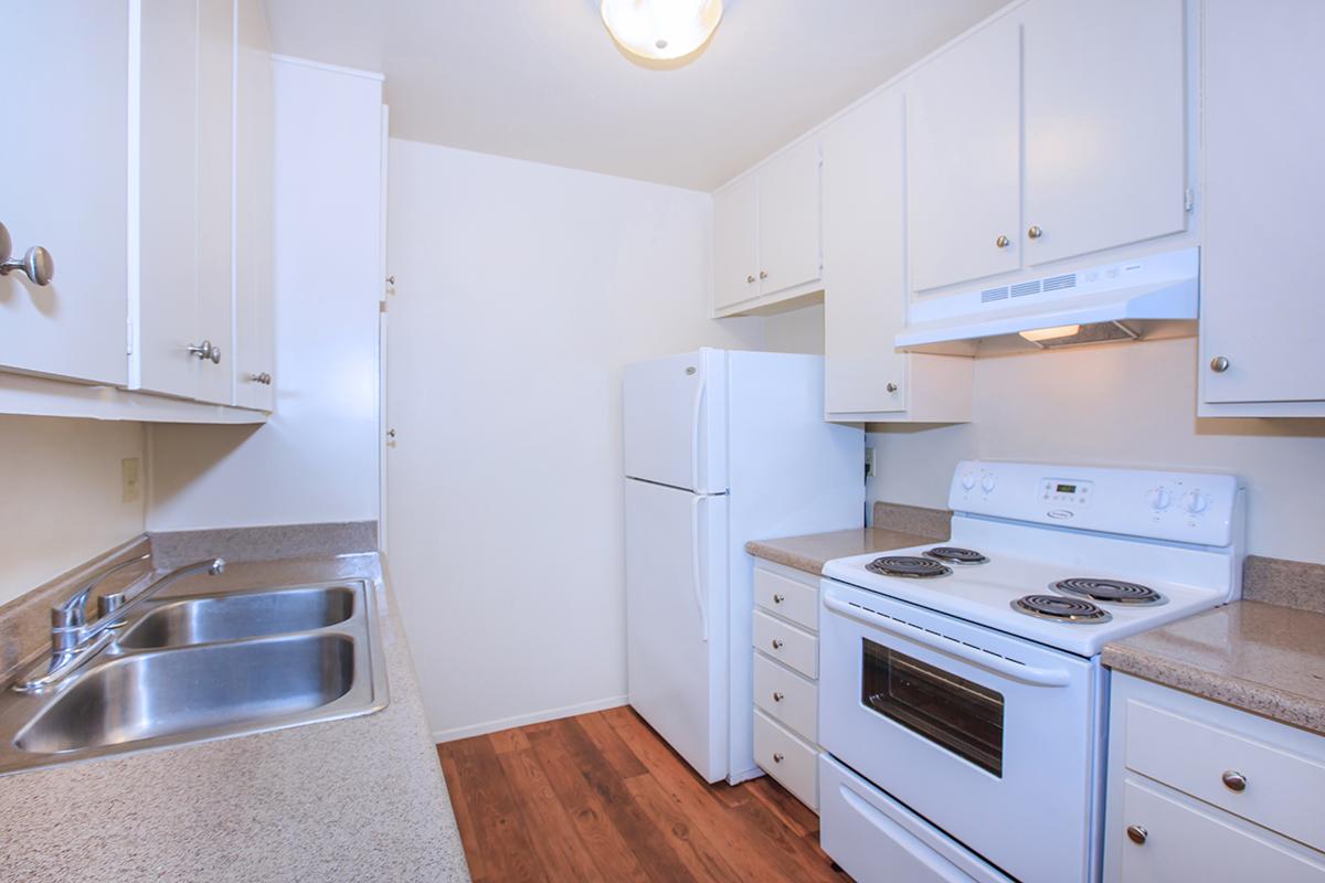 a kitchen with a stove top oven