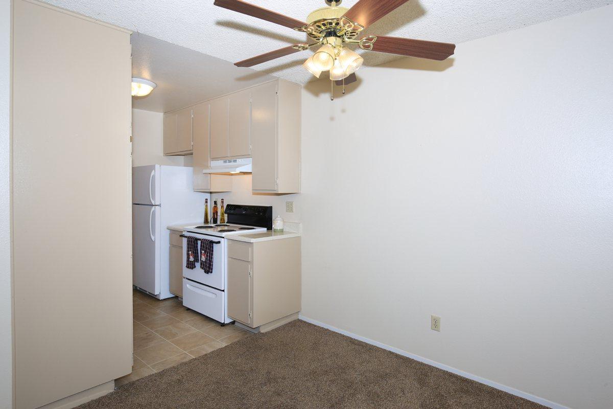 a white refrigerator freezer sitting inside of a kitchen