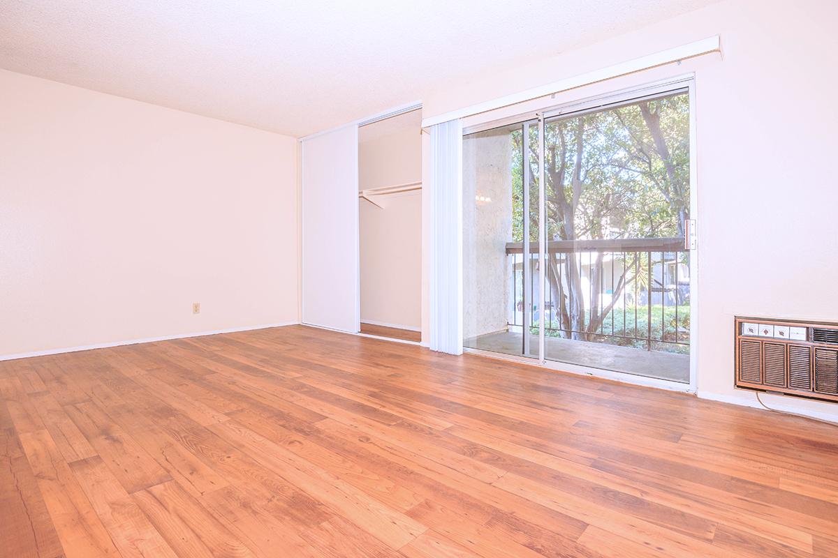 a large empty room with a wooden floor