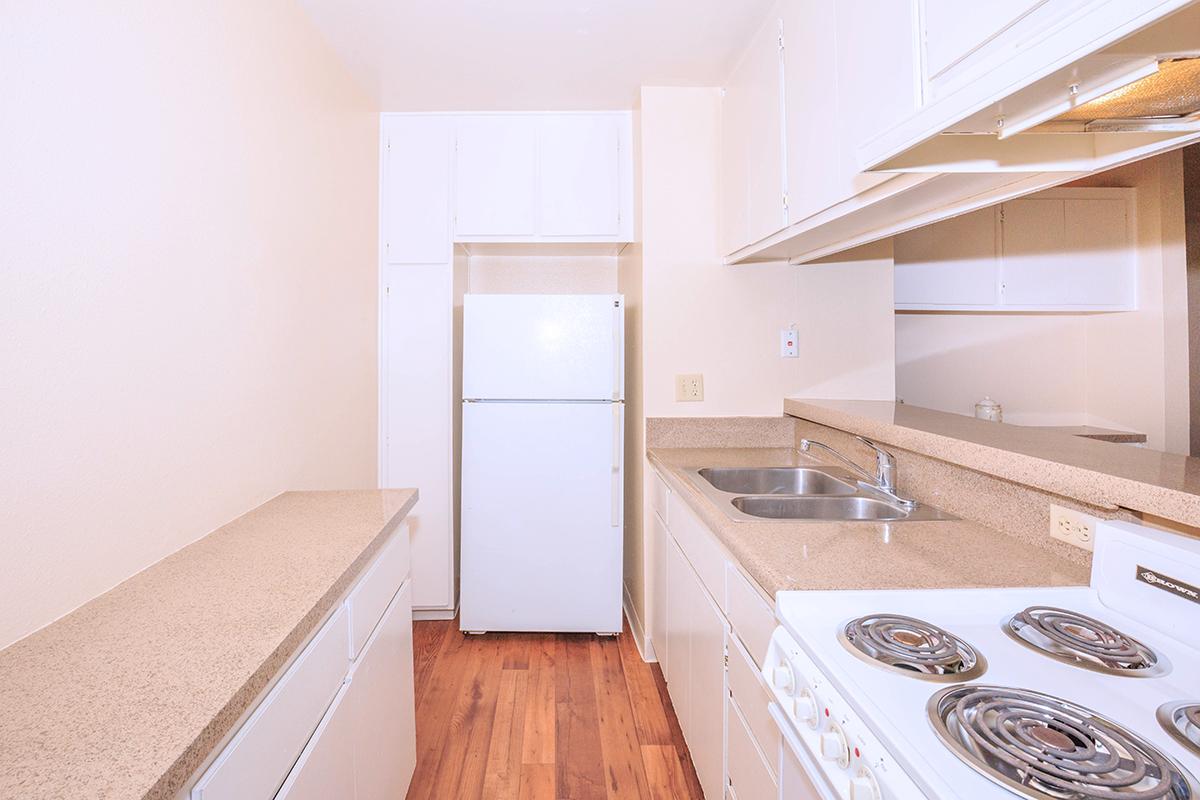 a kitchen with a building in the background