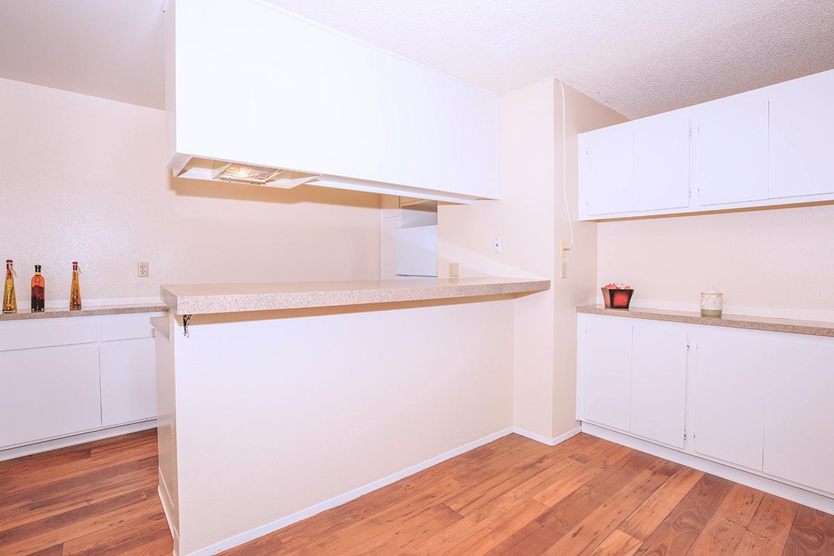 a kitchen with a wood floor