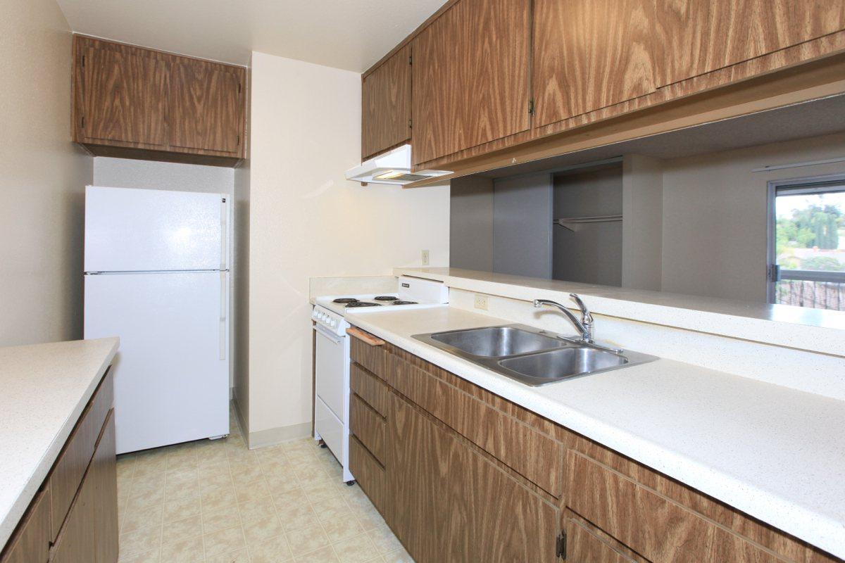 a kitchen with a sink and a window