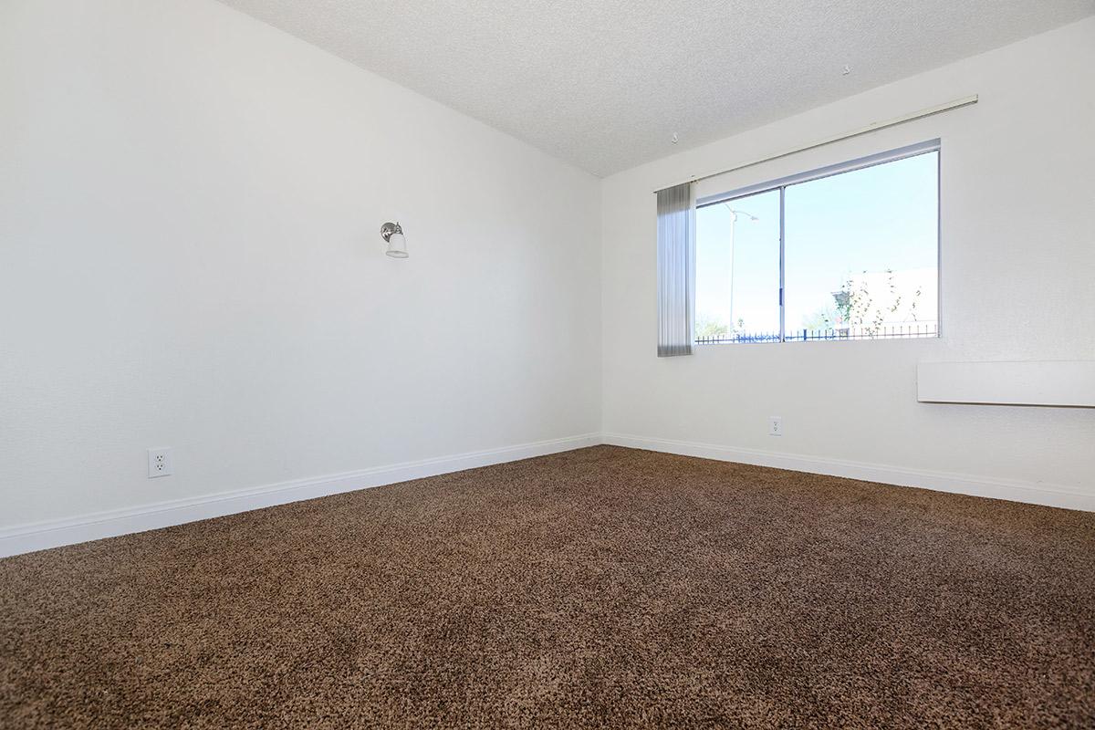 COMFORTABLE BEDROOM AT WOODHAVEN APARTMENTS IN LAS VEGAS
