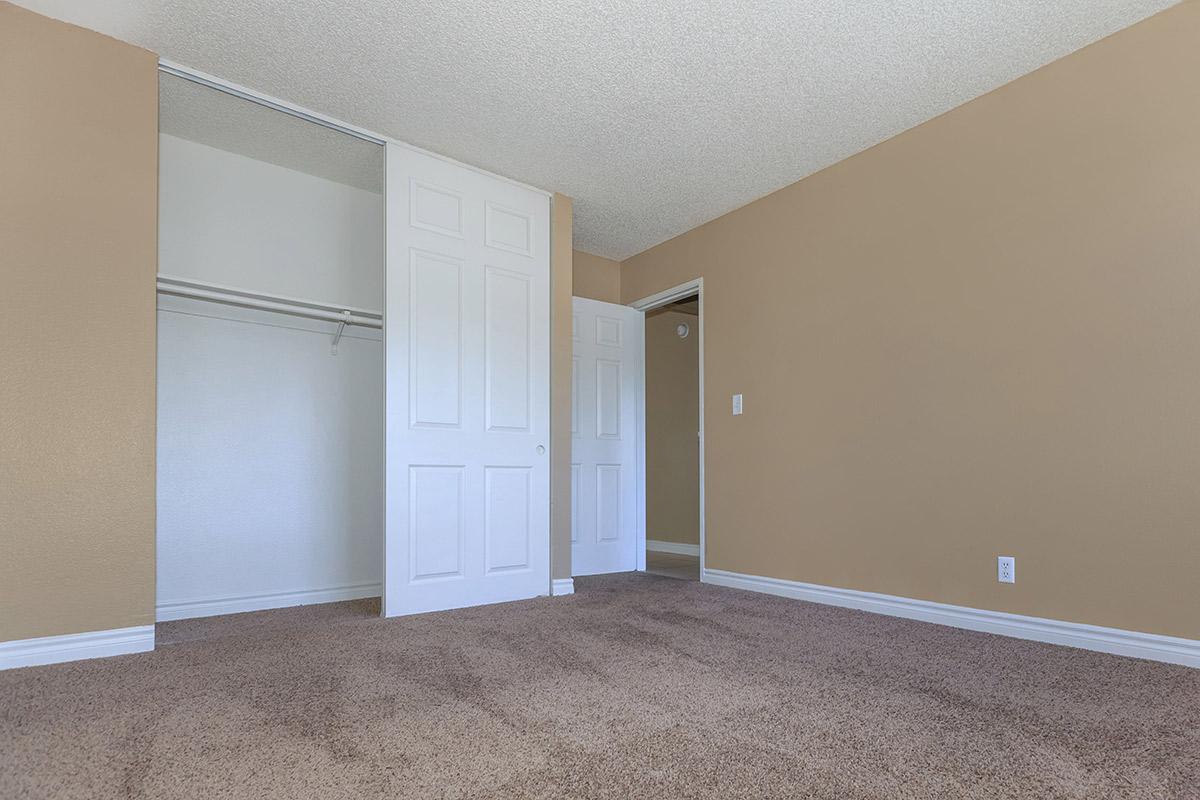 COMFORTABLE BEDROOM AT WOODHAVEN APARTMENTS IN LAS VEGAS
