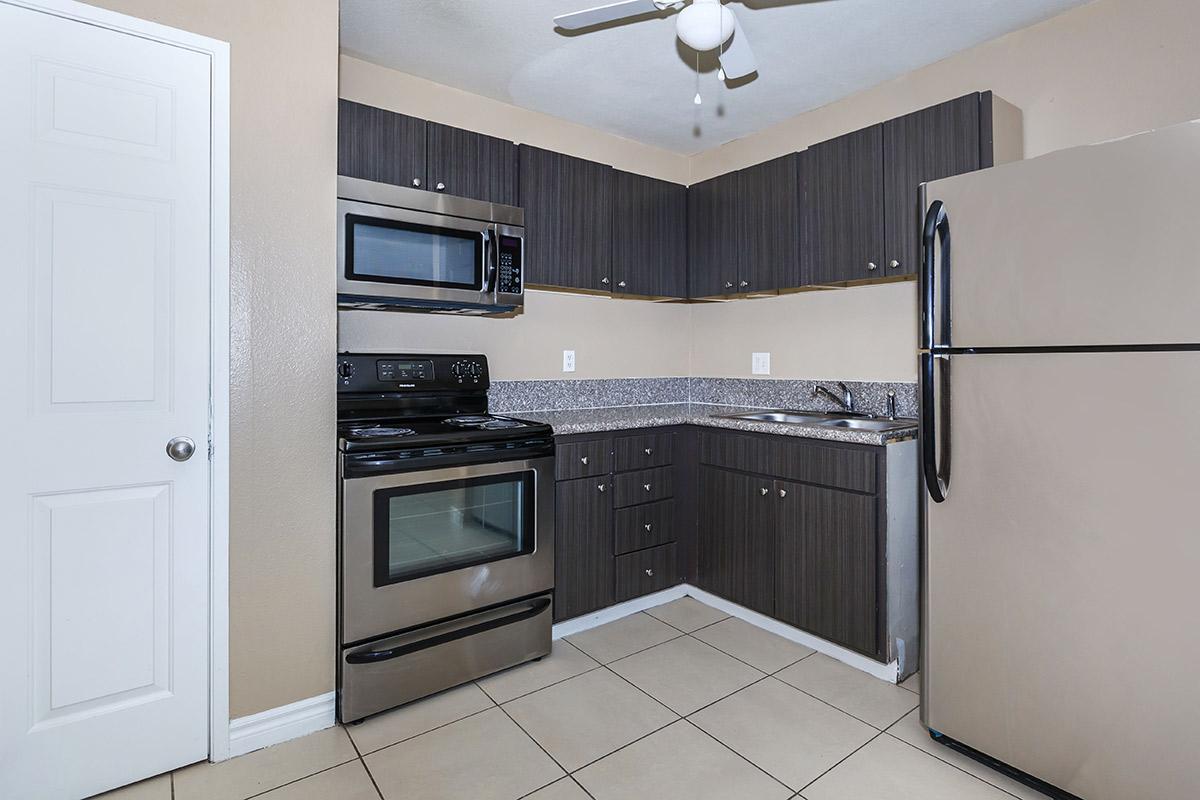 FULLY-EQUIPPED KITCHEN AT WOODHAVEN APARTMENTS IN LAS VEGAS