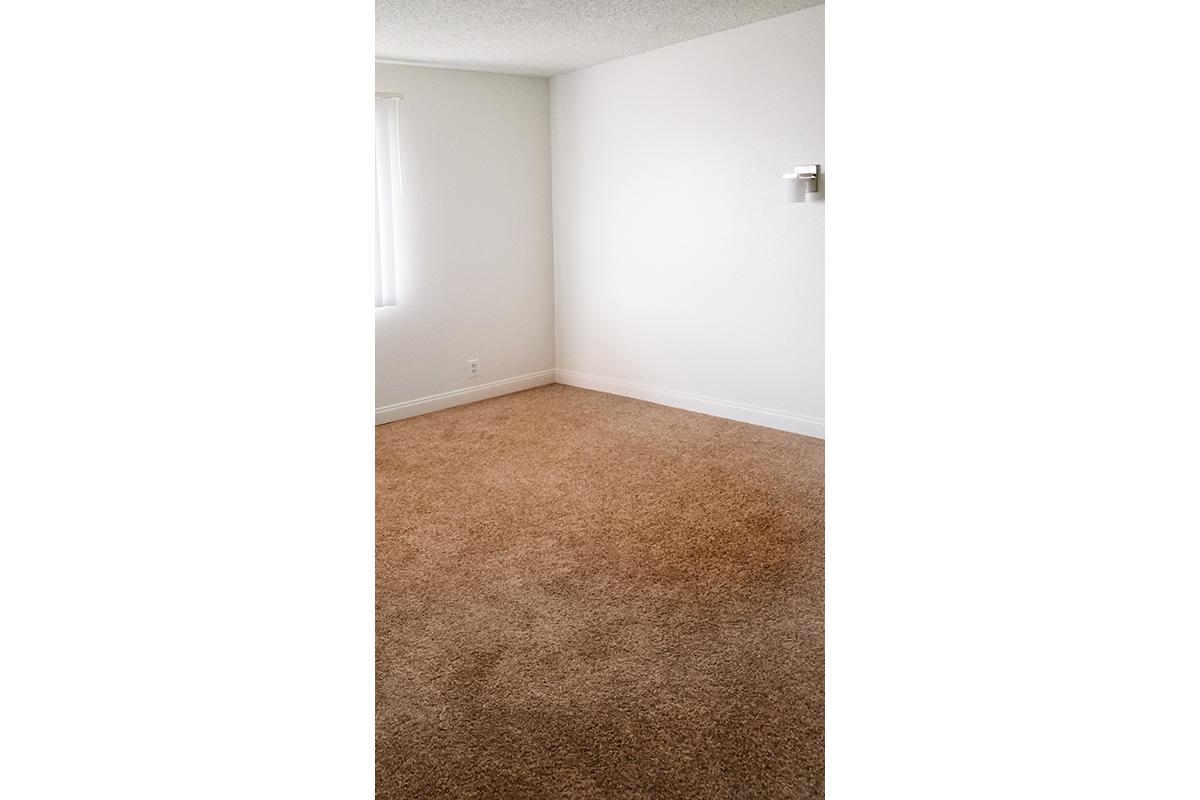 COMFORTABLE BEDROOM AT WOODHAVEN APARTMENTS IN LAS VEGAS
