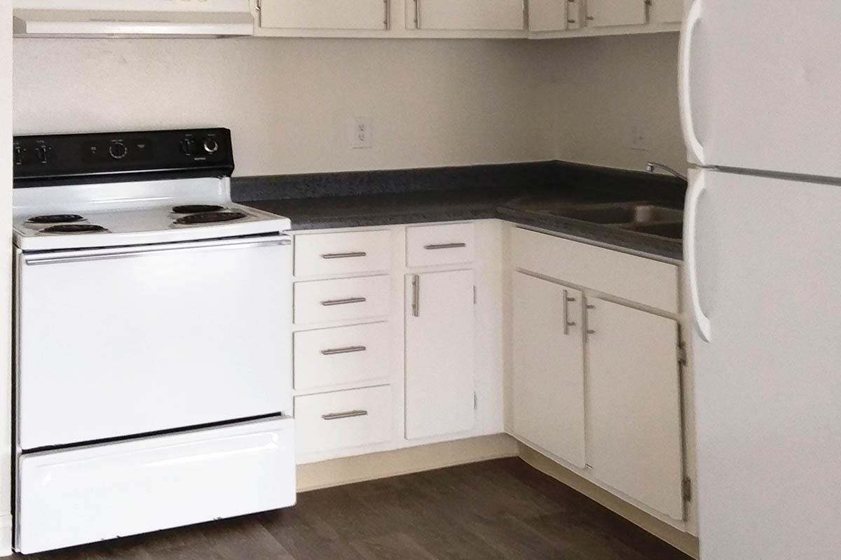 FULLY-EQUIPPED KITCHEN AT WOODHAVEN APARTMENTS IN LAS VEGAS
